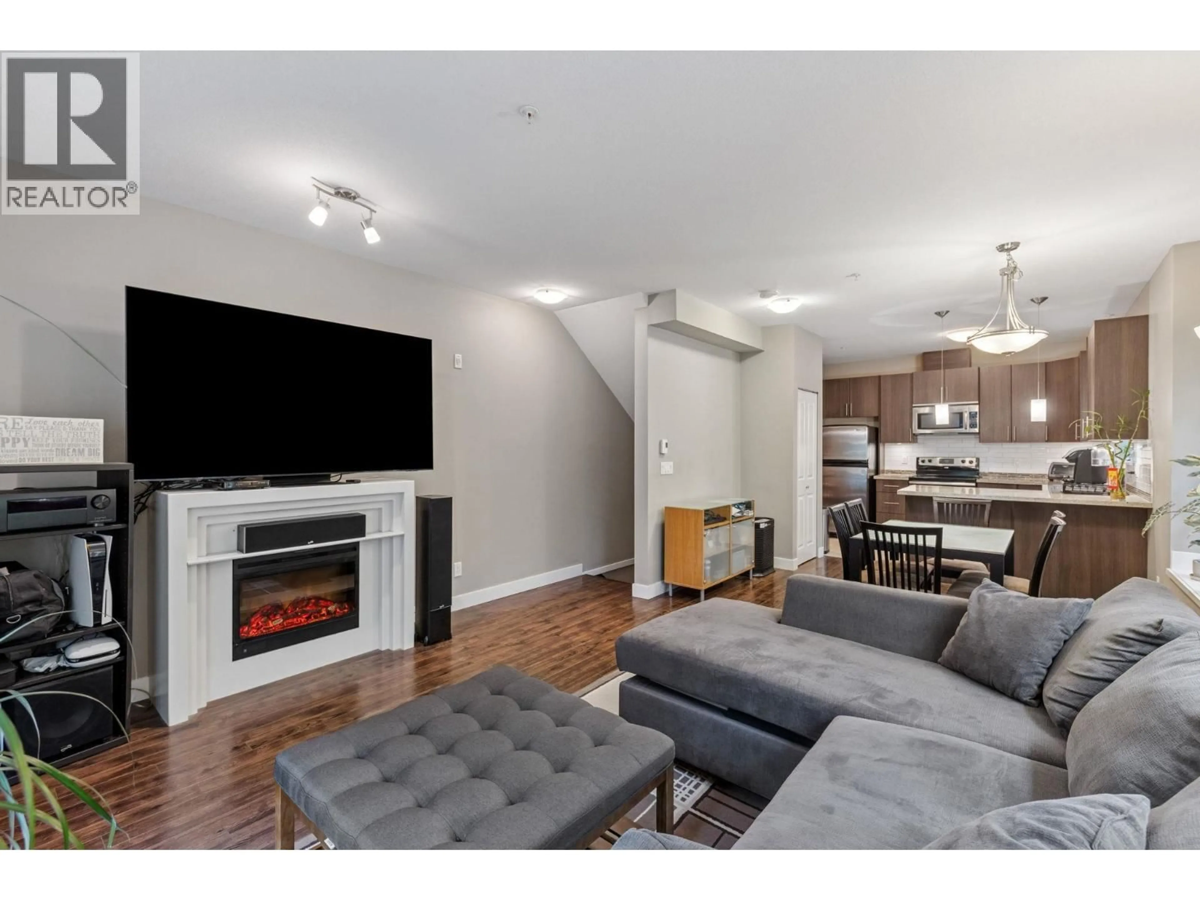 Living room with furniture, wood/laminate floor for 207 - 3888 NORFOLK STREET, Burnaby British Columbia V5G1E5