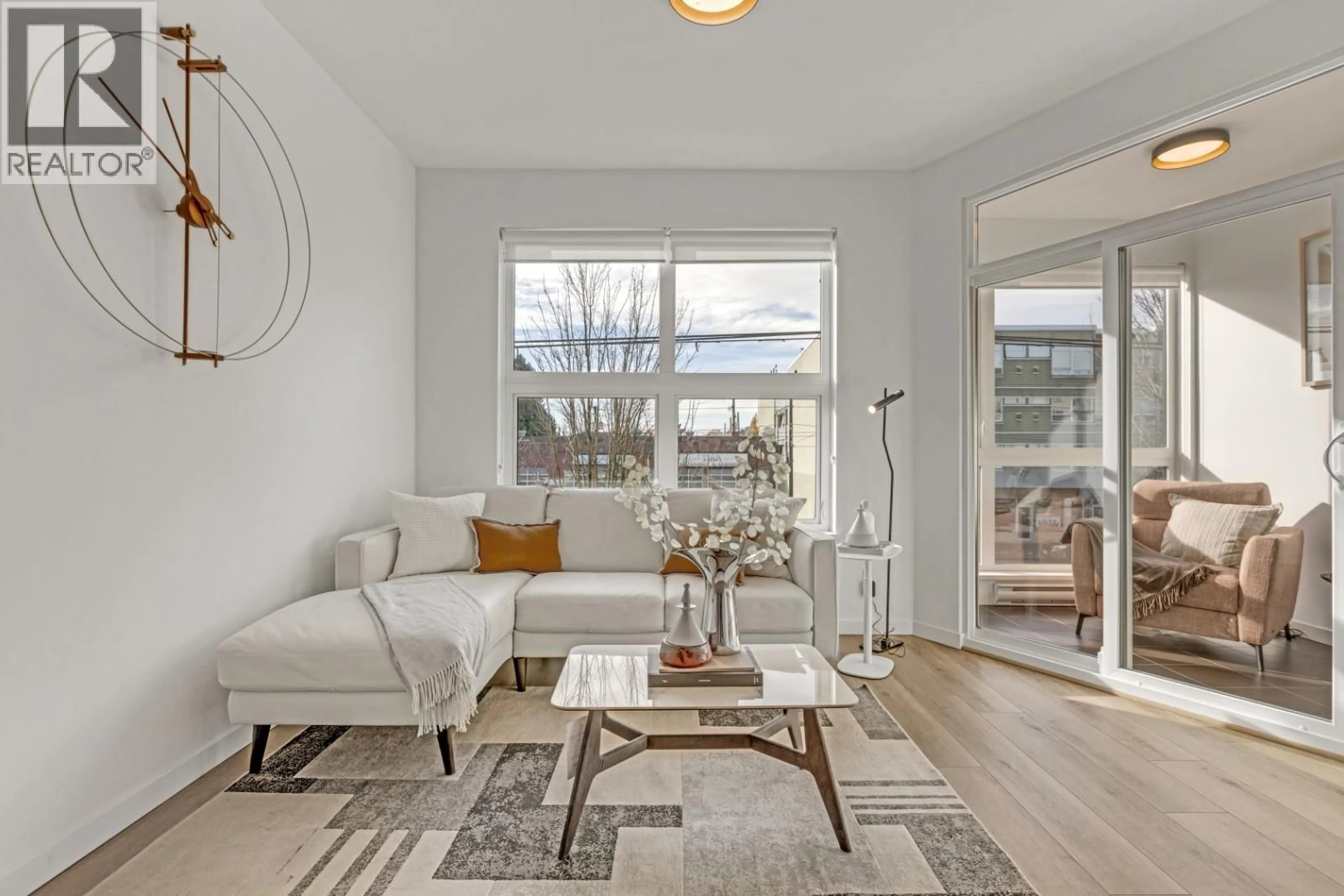 Living room with furniture, wood/laminate floor for 207 - 2239 KINGSWAY, Vancouver British Columbia V5N0E5