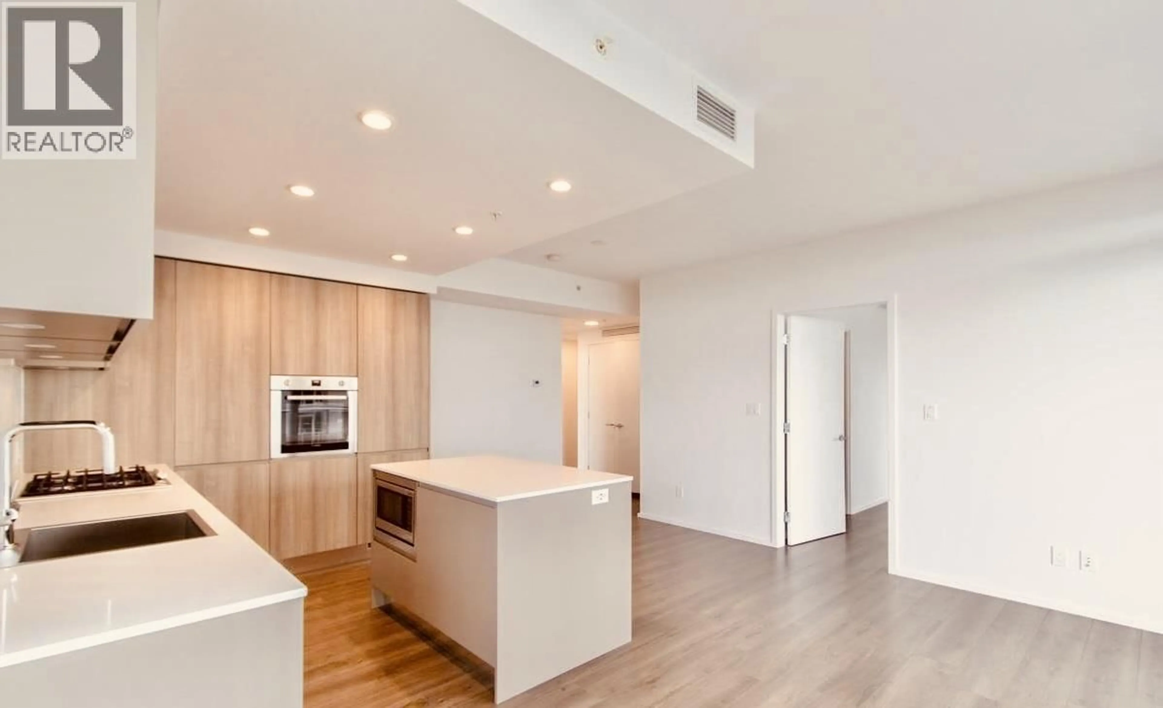 Open concept kitchen, wood/laminate floor for 5002 - 3809 EVERGREEN PLACE, Burnaby British Columbia V3J0M1