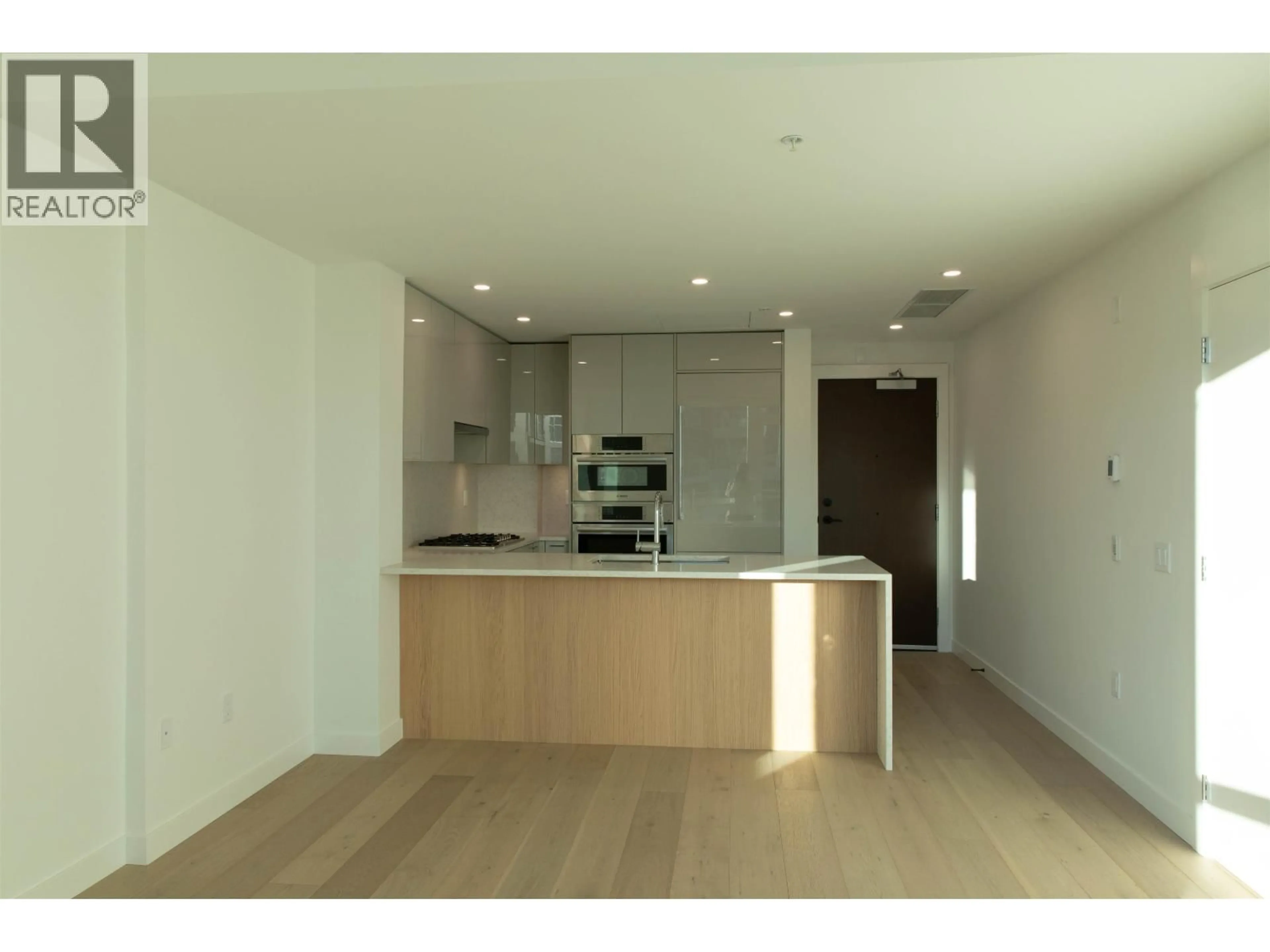 Open concept kitchen, wood/laminate floor for 409 - 5058 CAMBIE STREET, Vancouver British Columbia V5Z2Z5