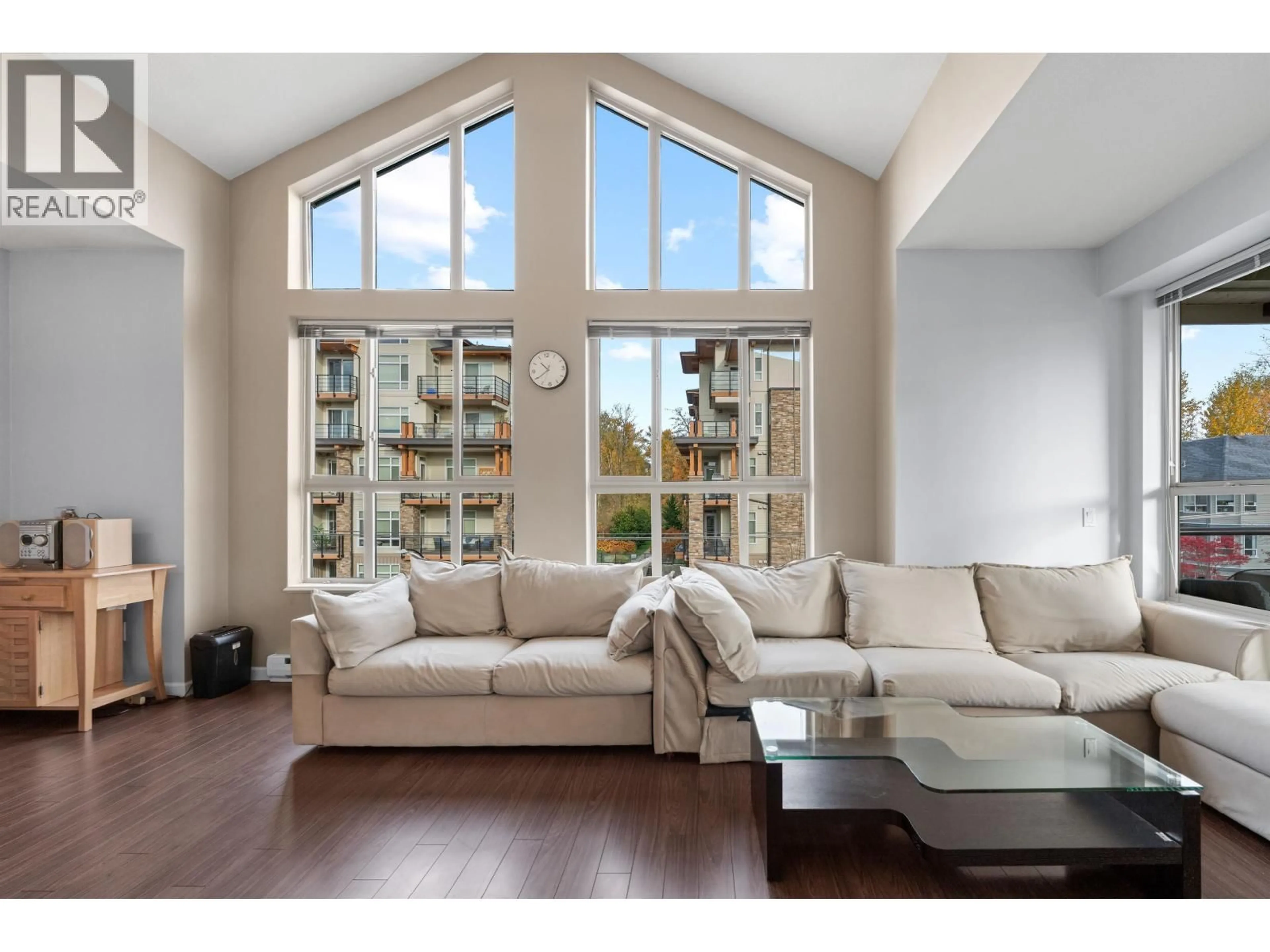 Living room with furniture, wood/laminate floor for 414 - 2484 WILSON AVENUE, Port Coquitlam British Columbia V3C0A5