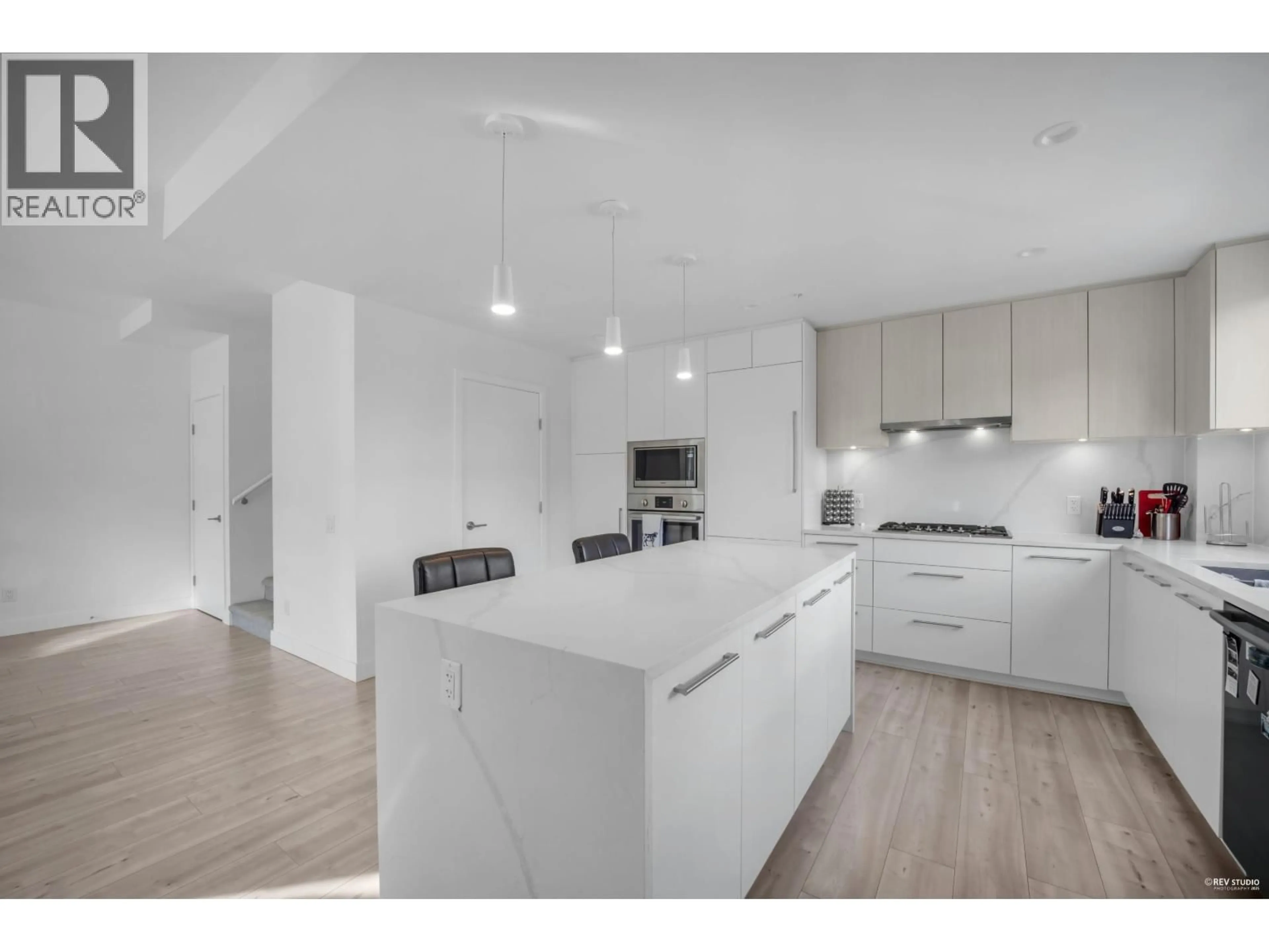 Open concept kitchen, wood/laminate floor for 247 - 2035 GLENAIRE DRIVE, North Vancouver British Columbia V7P1Y2