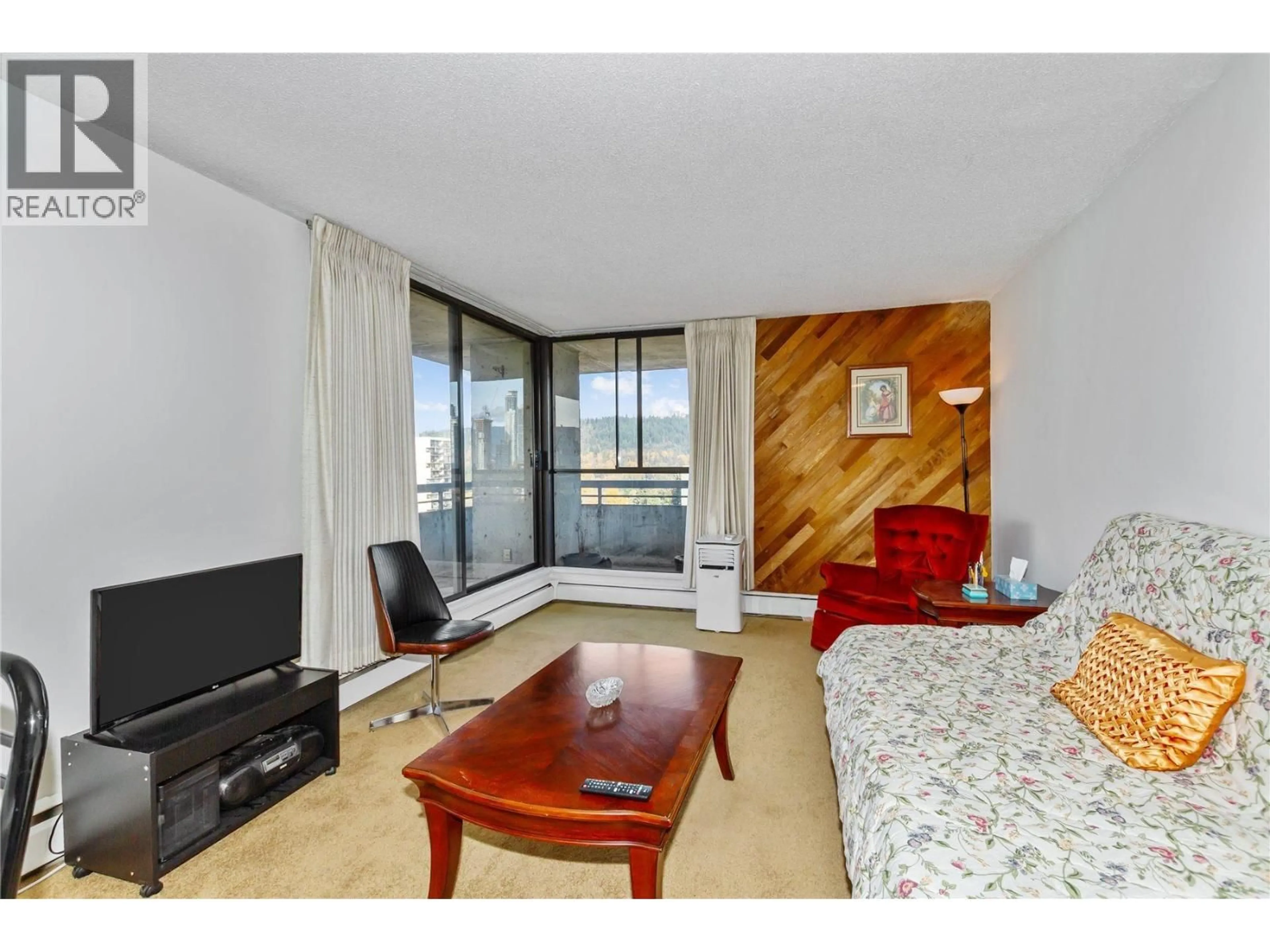 Living room with furniture, wood/laminate floor for 2402 - 3755 BARTLETT COURT, Burnaby British Columbia V3J7G7