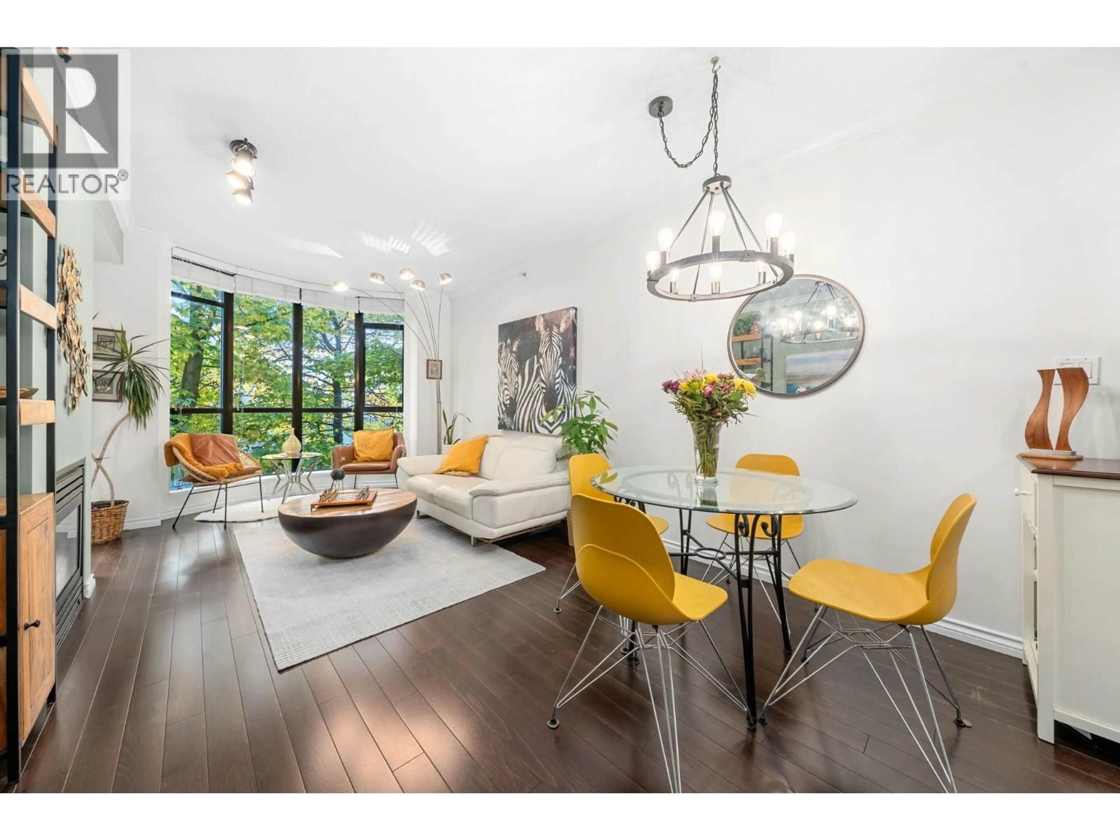 Living room with furniture, wood/laminate floor for 314 - 170 1ST STREET, North Vancouver British Columbia V7M3P2