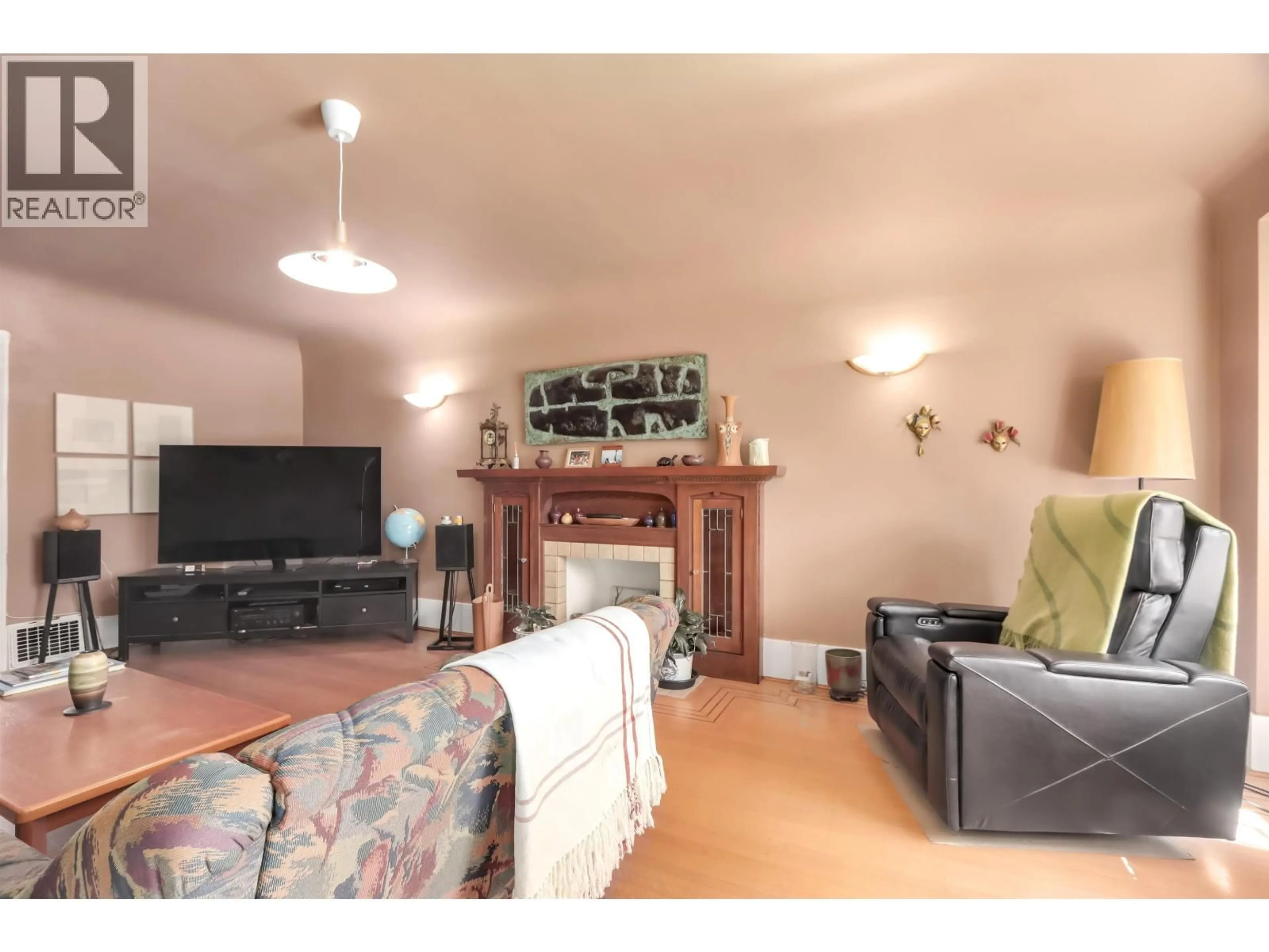 Living room with furniture, wood/laminate floor for 4529 8TH AVENUE, Vancouver British Columbia V6R2A4