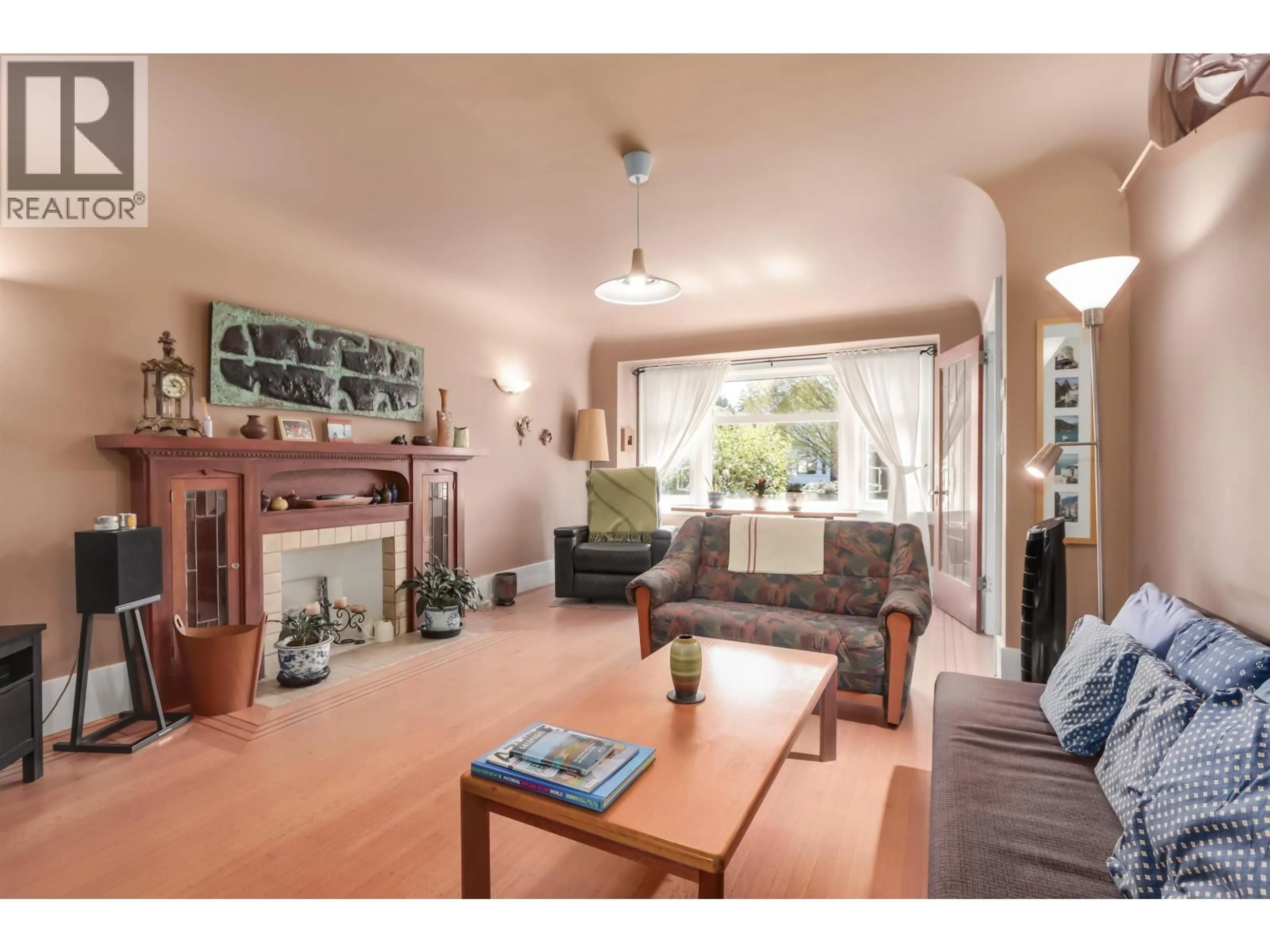 Living room with furniture, wood/laminate floor for 4529 8TH AVENUE, Vancouver British Columbia V6R2A4