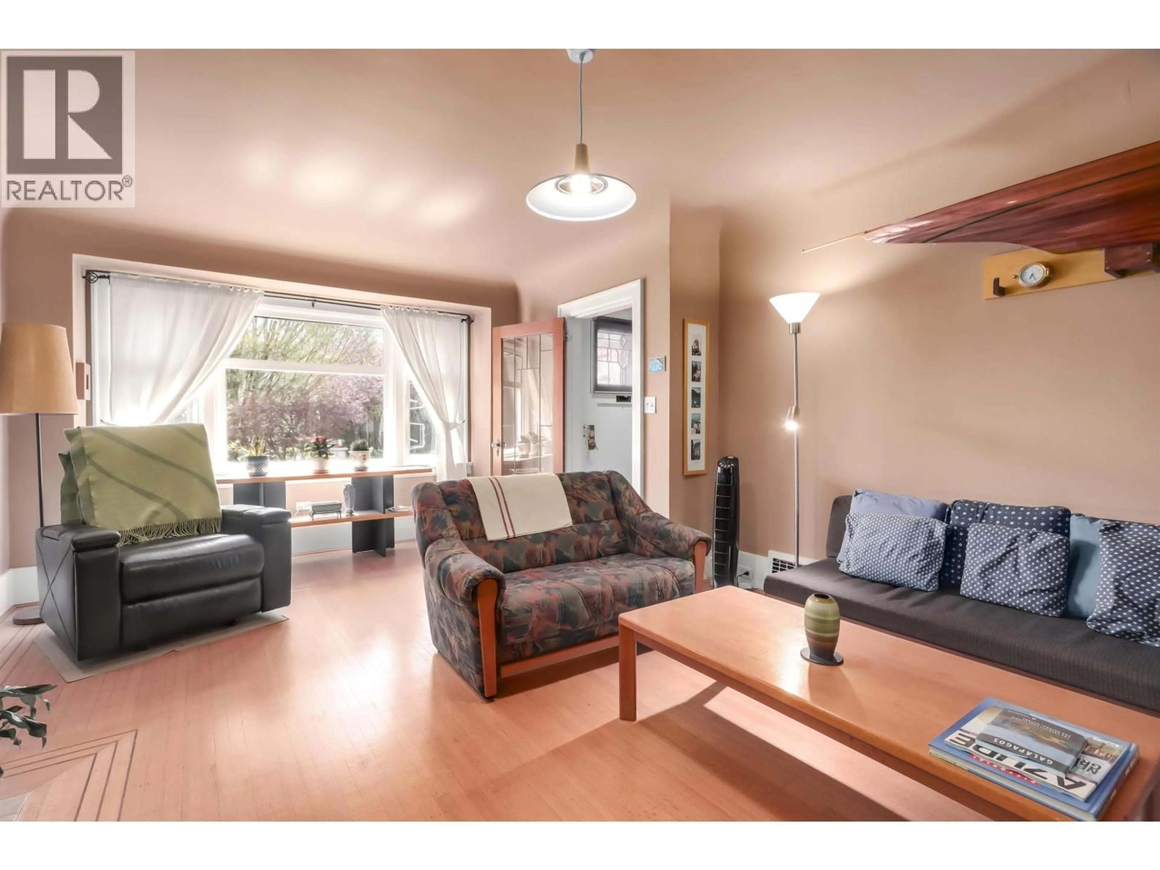 Living room with furniture, wood/laminate floor for 4529 8TH AVENUE, Vancouver British Columbia V6R2A4