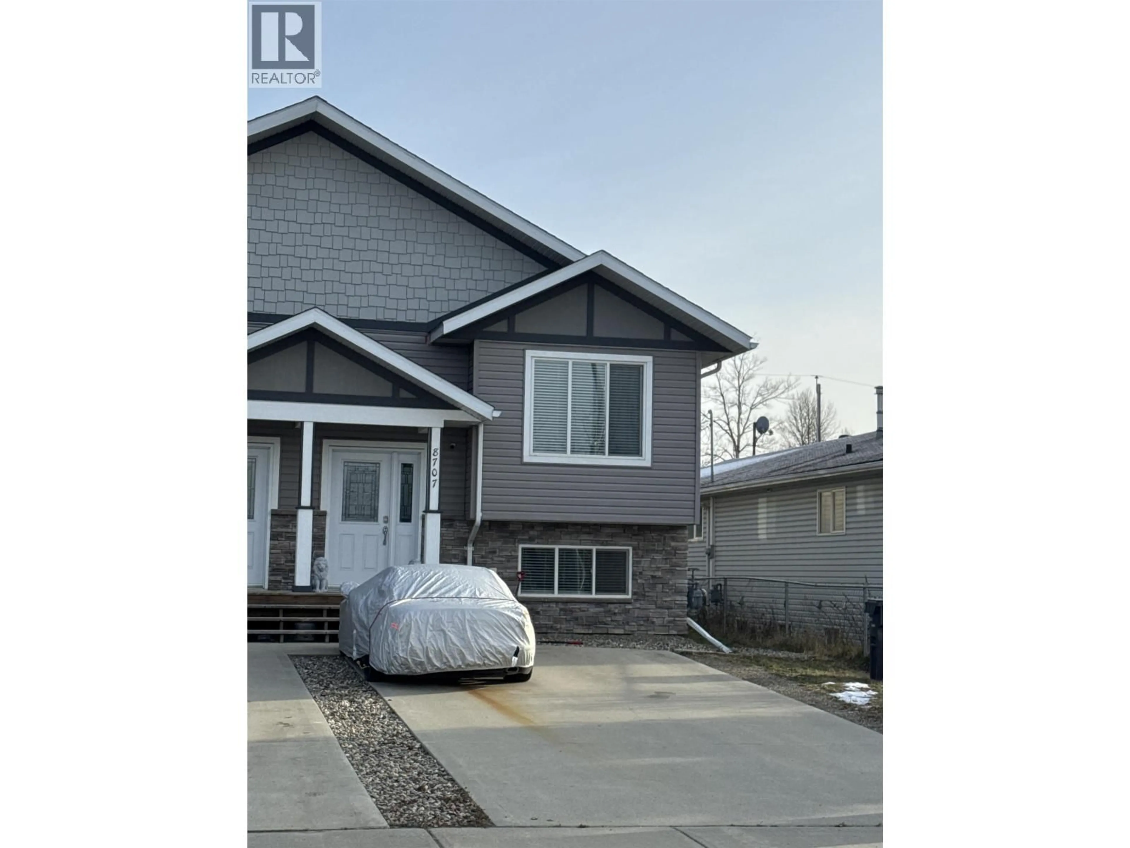 Home with vinyl exterior material, street for 8707 76 STREET, Fort St. John British Columbia V1J2Z5