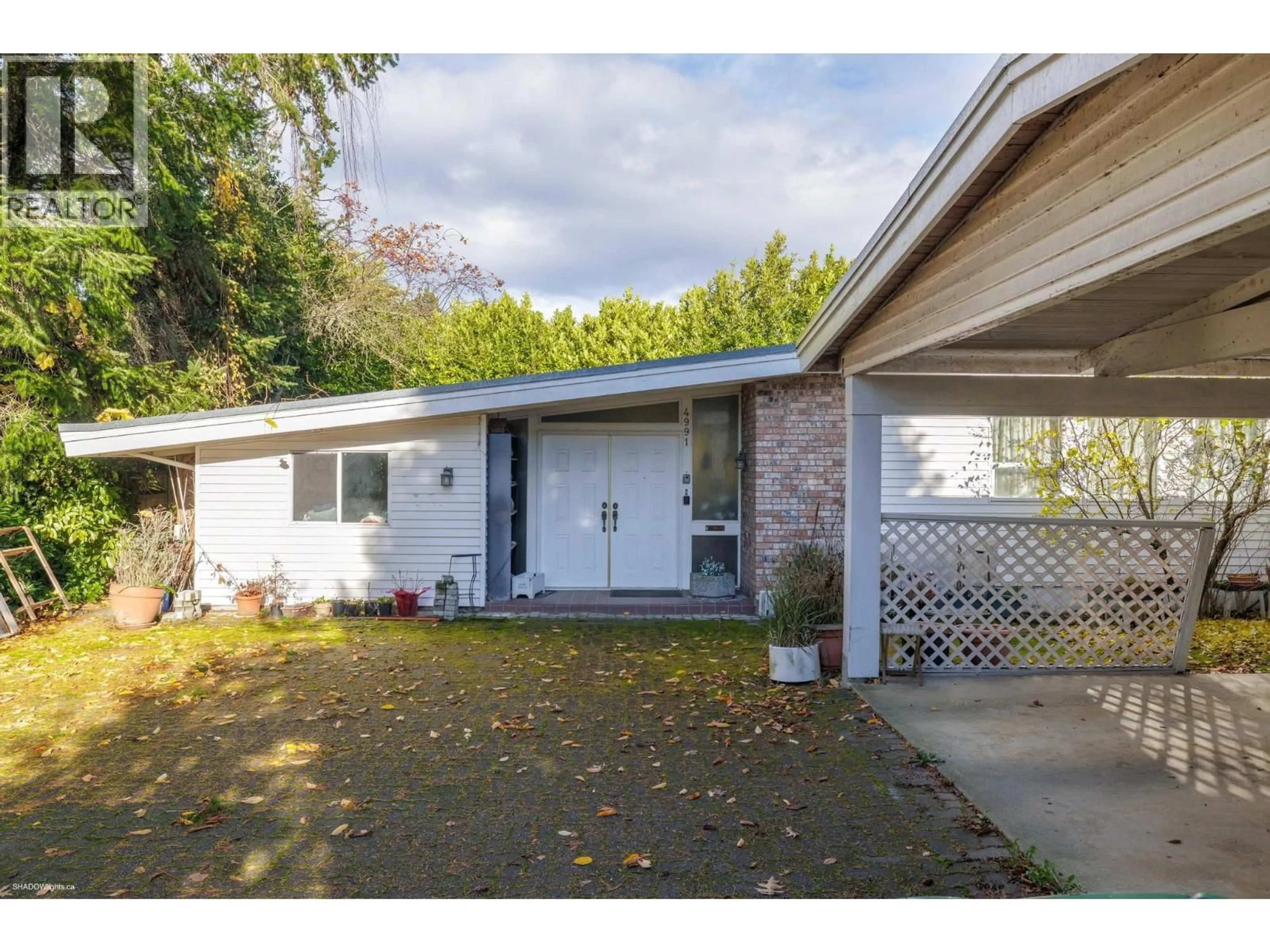 Home with vinyl exterior material, street for 4991 WESTMINSTER HIGHWAY, Richmond British Columbia V7C1B7