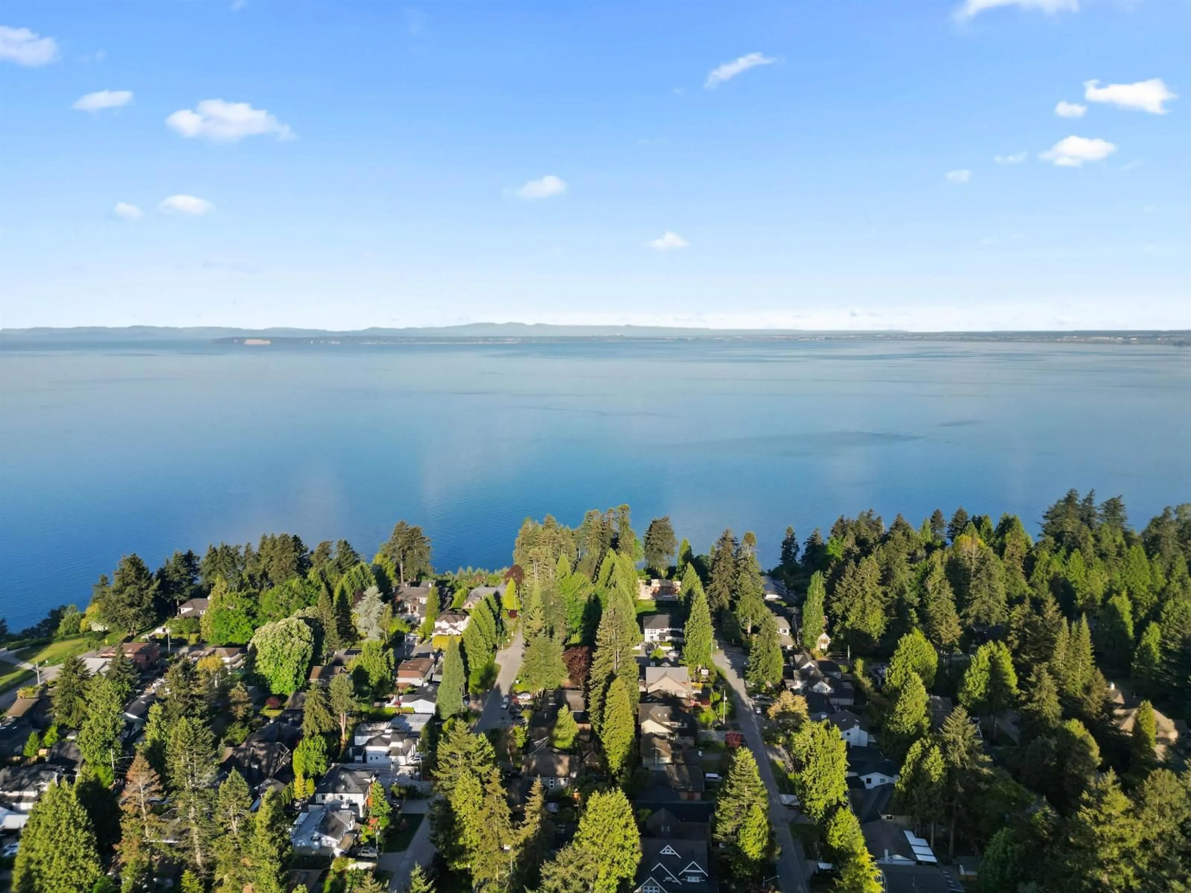 A pic from outside/outdoor area/front of a property/back of a property/a pic from drone, water/lake/river/ocean view for 12775 15A, Surrey British Columbia V4A1L9