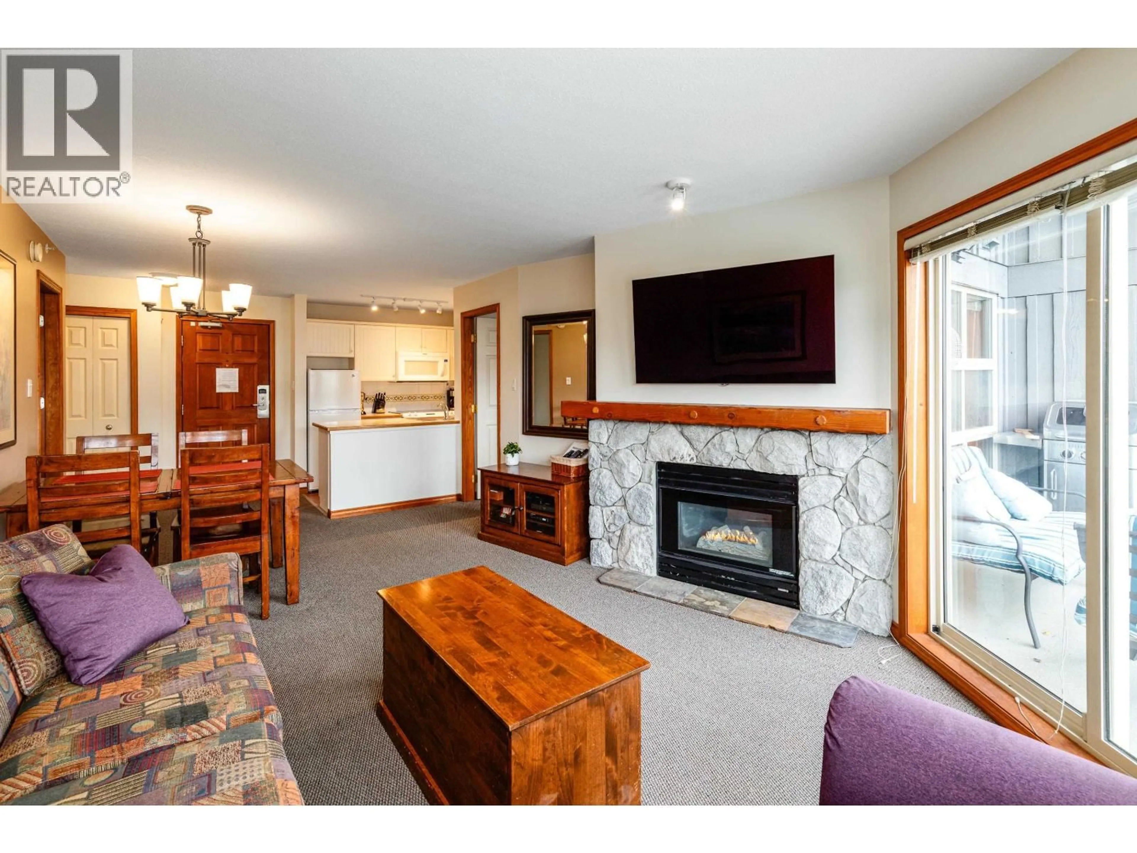 Living room with furniture, wood/laminate floor for 557 - 4800 SPEARHEAD DRIVE, Whistler British Columbia V8E1G1