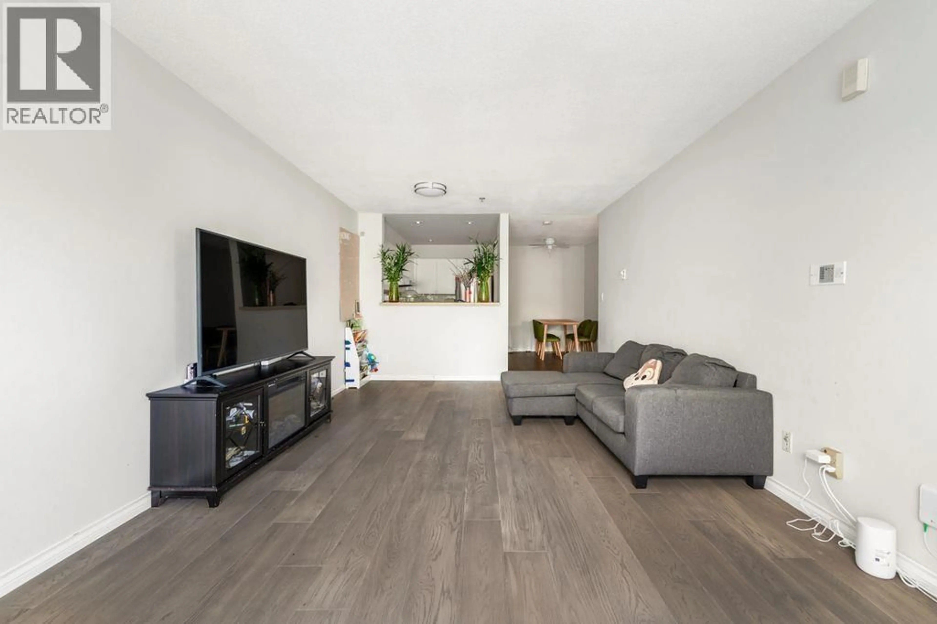 Living room with furniture, wood/laminate floor for 107 - 8620 JONES ROAD, Richmond British Columbia V6Y3Z4