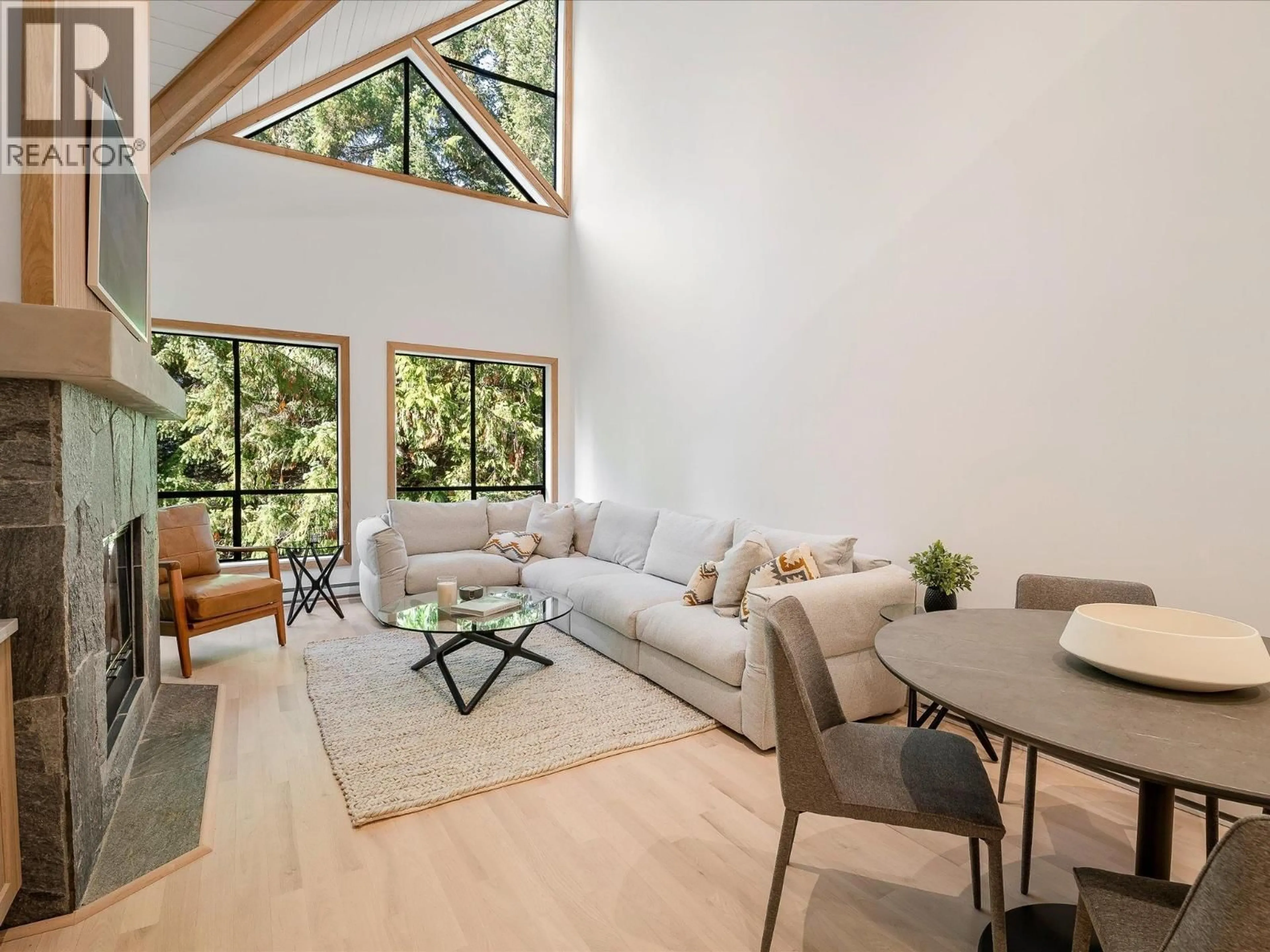 Living room with furniture, wood/laminate floor for 310 - 4821 SPEARHEAD DRIVE, Whistler British Columbia V8E1E8