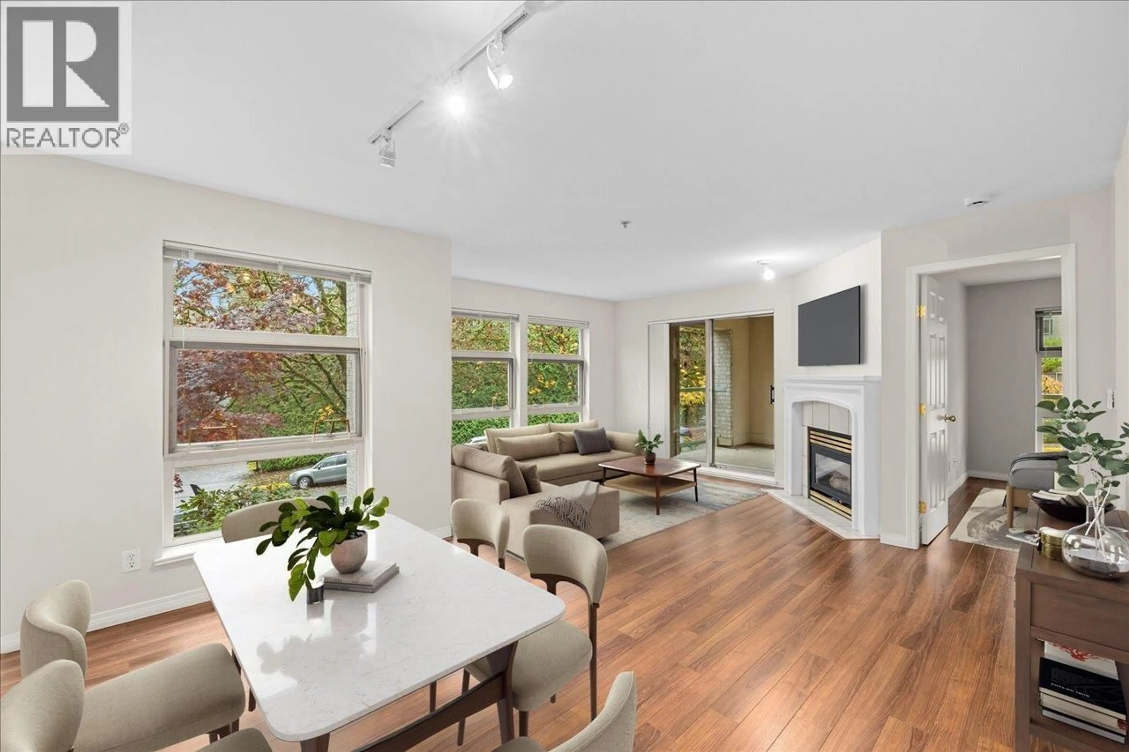 Living room with furniture, wood/laminate floor for 208 - 301 MAUDE ROAD, Port Moody British Columbia V3H5B1