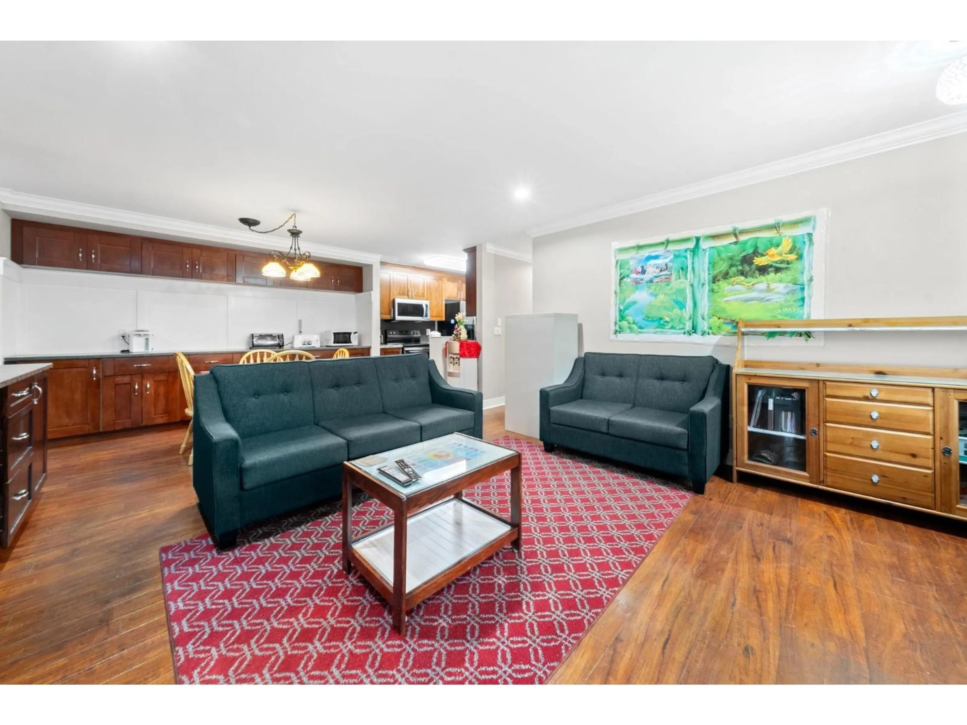 Living room with furniture, wood/laminate floor for 57 - 8358 121A, Surrey British Columbia V3W1T6