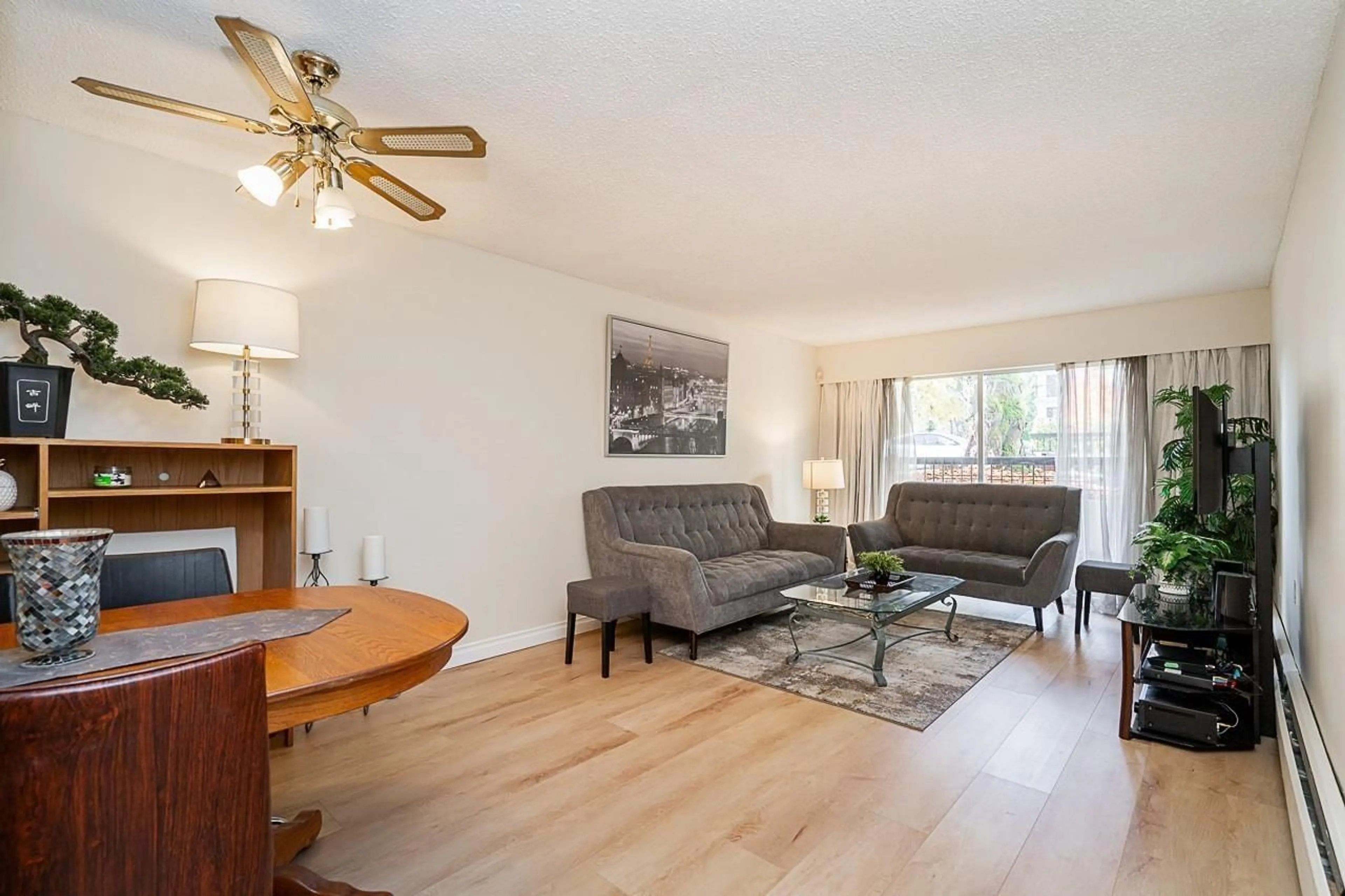 Living room with furniture, wood/laminate floor for 107A - 8635 120, Delta British Columbia V4C6R5