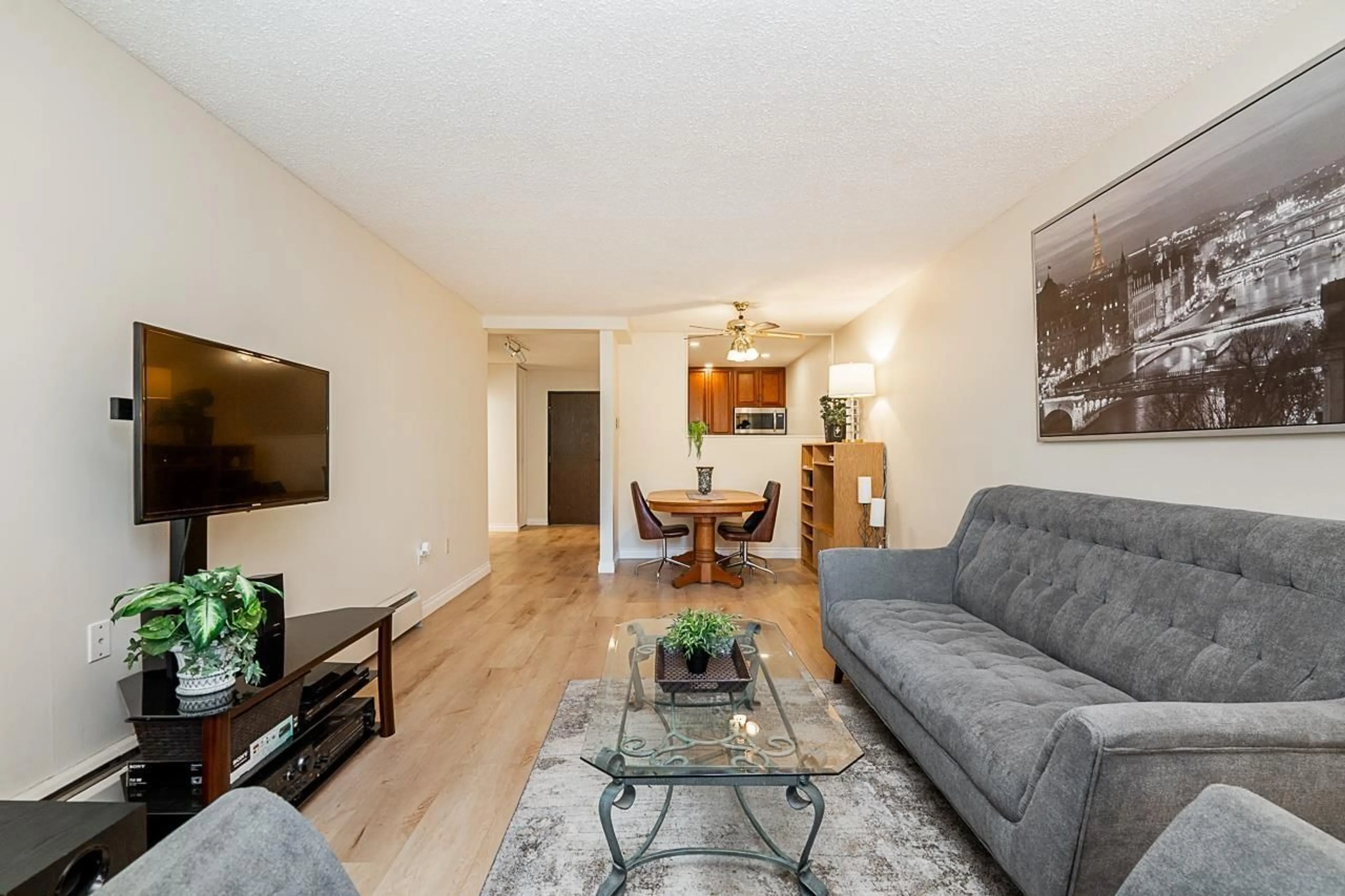 Living room with furniture, wood/laminate floor for 107A - 8635 120, Delta British Columbia V4C6R5