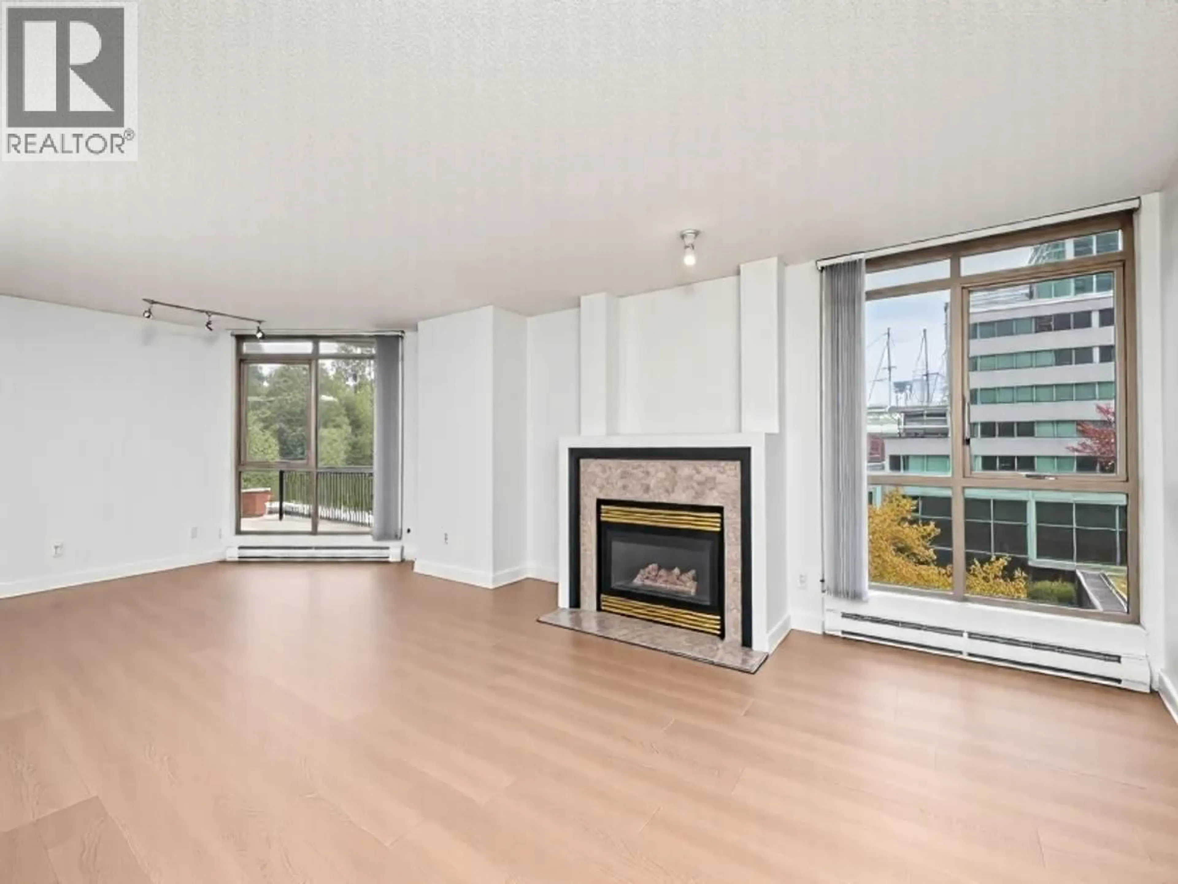 Living room with furniture, wood/laminate floor for 601 - 867 HAMILTON STREET, Vancouver British Columbia V6B6B7