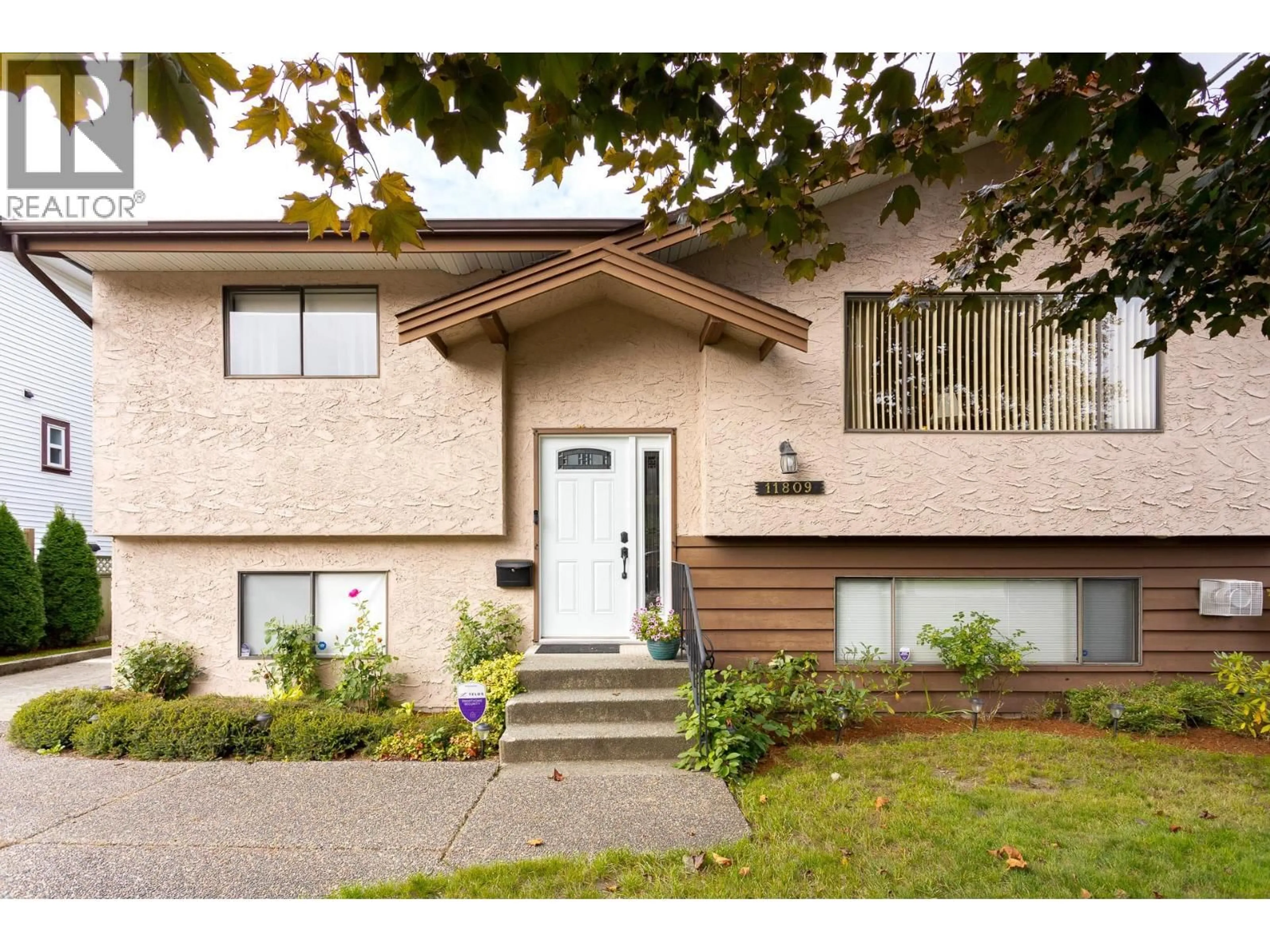 Home with vinyl exterior material, street for 11809 230 STREET, Maple Ridge British Columbia V2X6R3