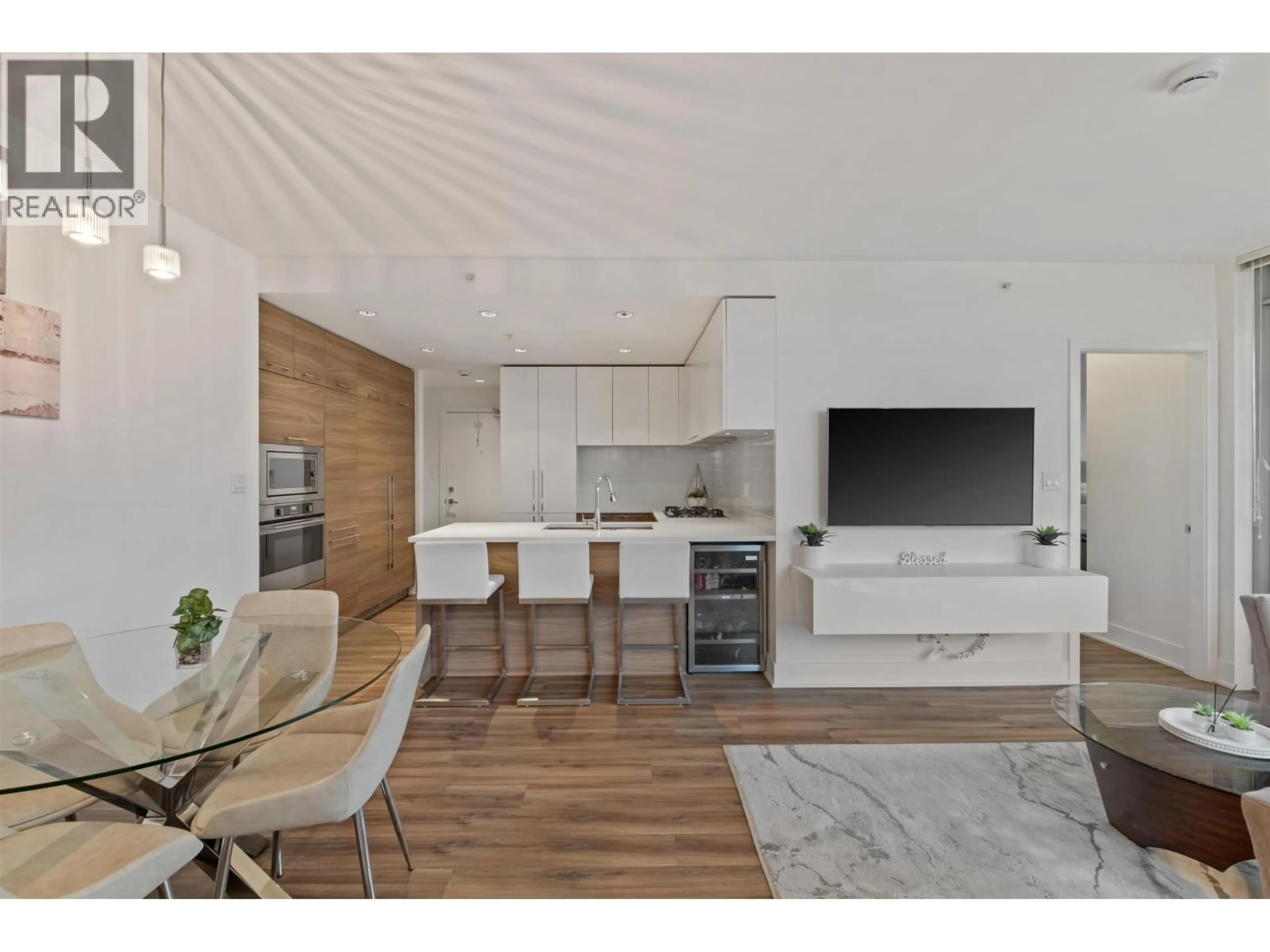 Open concept kitchen, wood/laminate floor for 3207 - 1188 PINETREE WAY, Coquitlam British Columbia V3B0K9