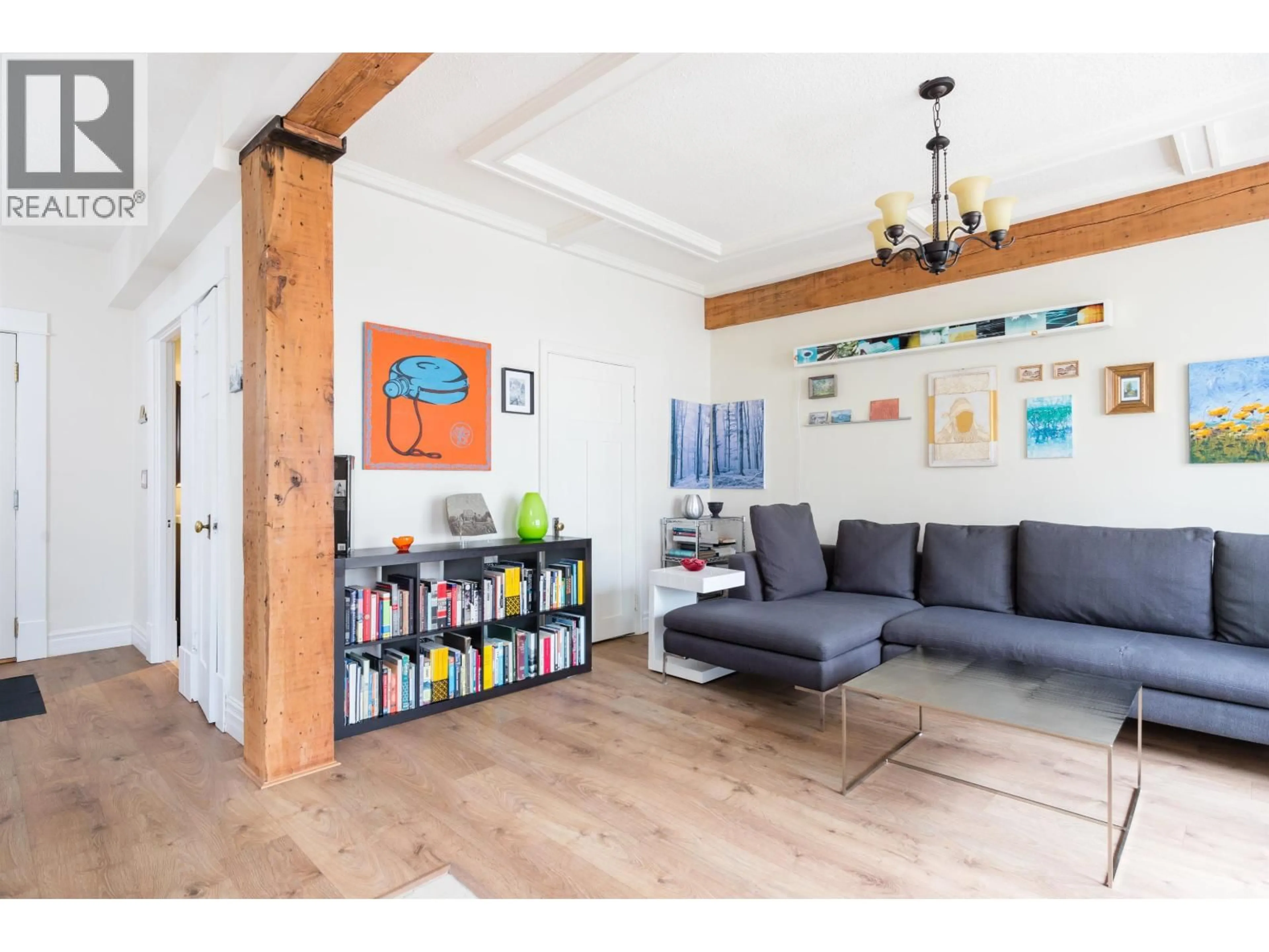 Living room with furniture, wood/laminate floor for 54 - 777 BURRARD STREET, Vancouver British Columbia V6Z1X7