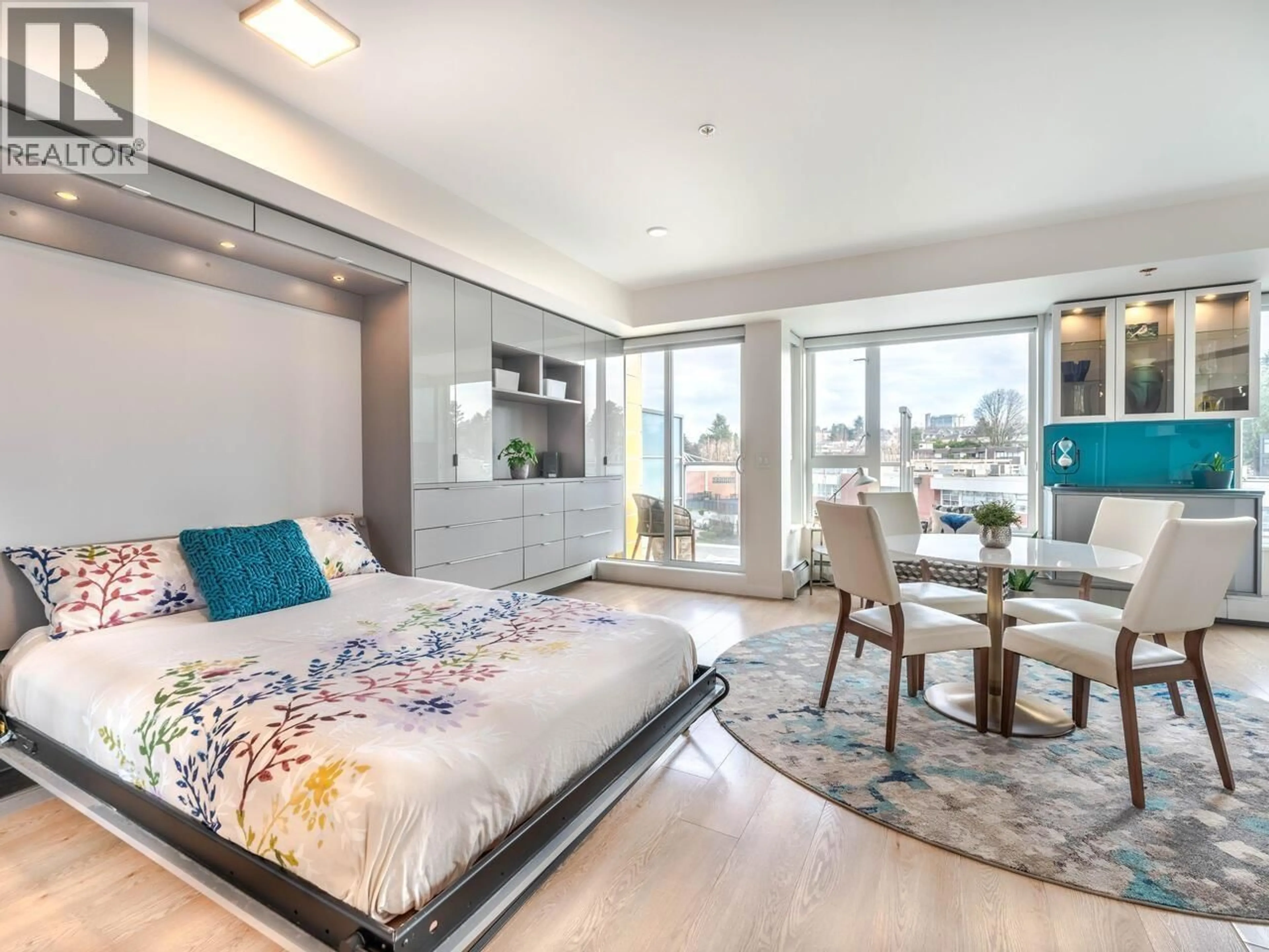 Bedroom with bed, wood/laminate floor for 609 - 417 GREAT NORTHERN WAY, Vancouver British Columbia V5T0G7