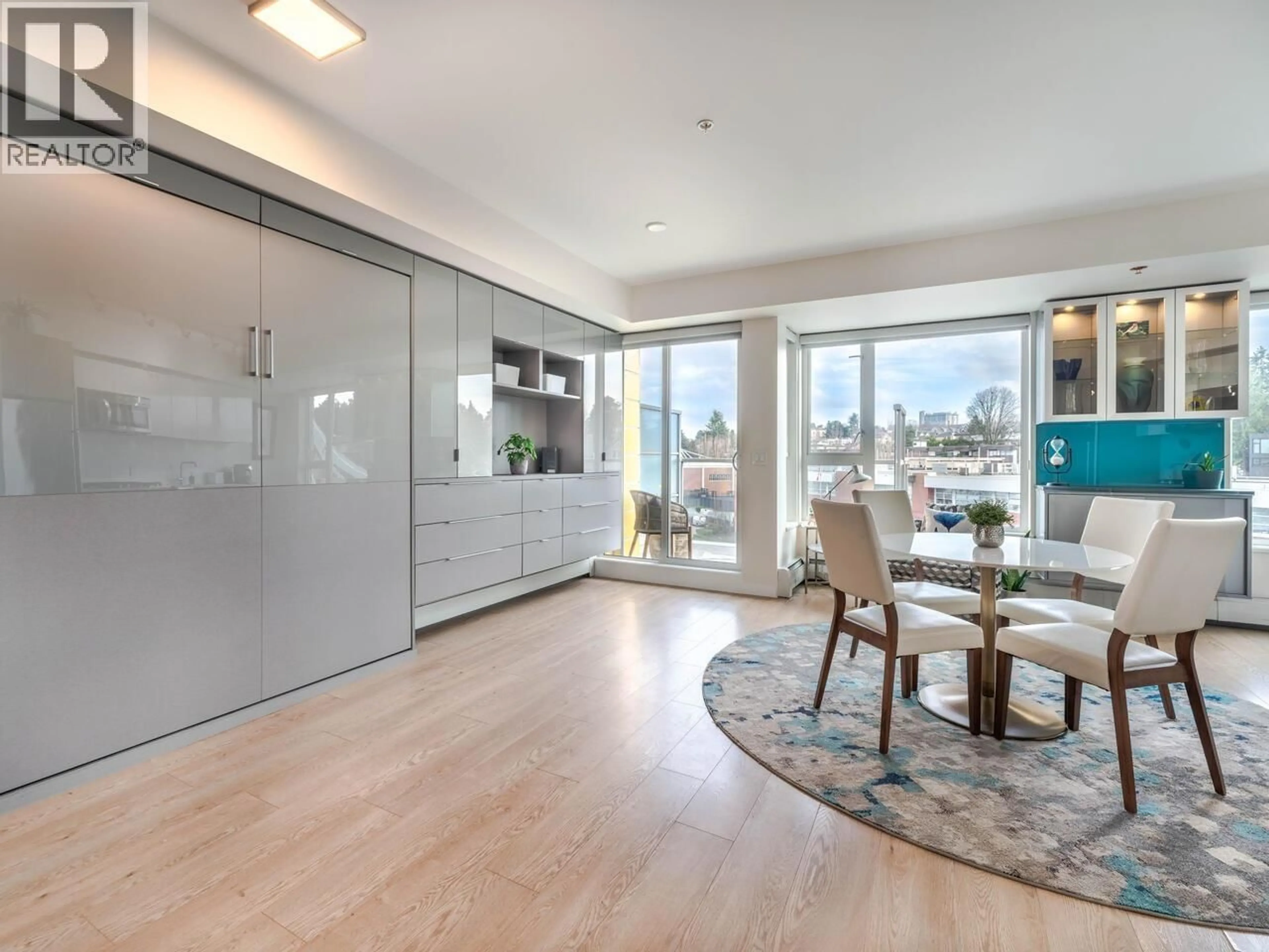 Open concept kitchen, wood/laminate floor for 609 - 417 GREAT NORTHERN WAY, Vancouver British Columbia V5T0G7