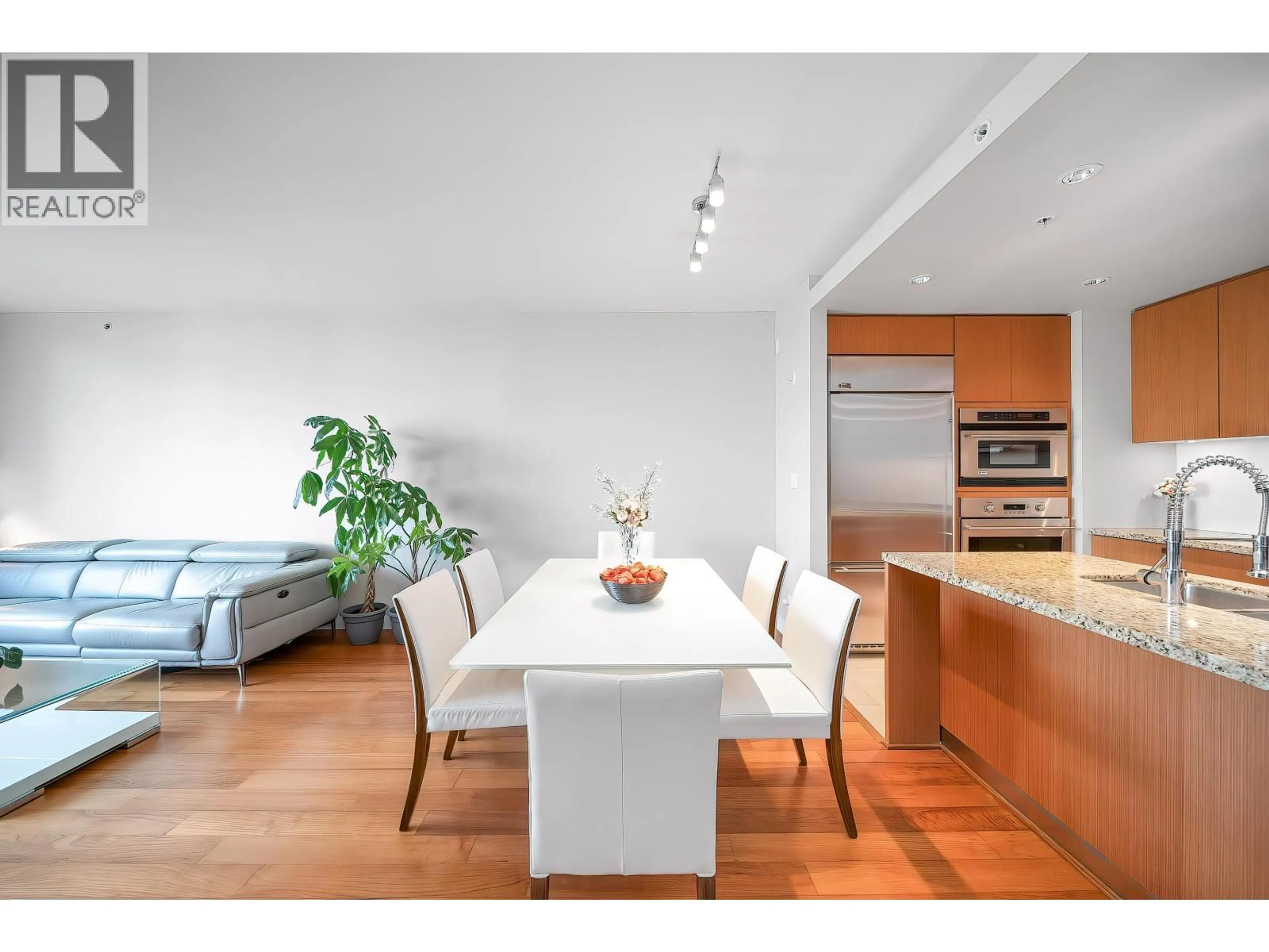 Open concept kitchen, wood/laminate floor for 404 - 6080 IONA DRIVE, Vancouver British Columbia V6T0A4