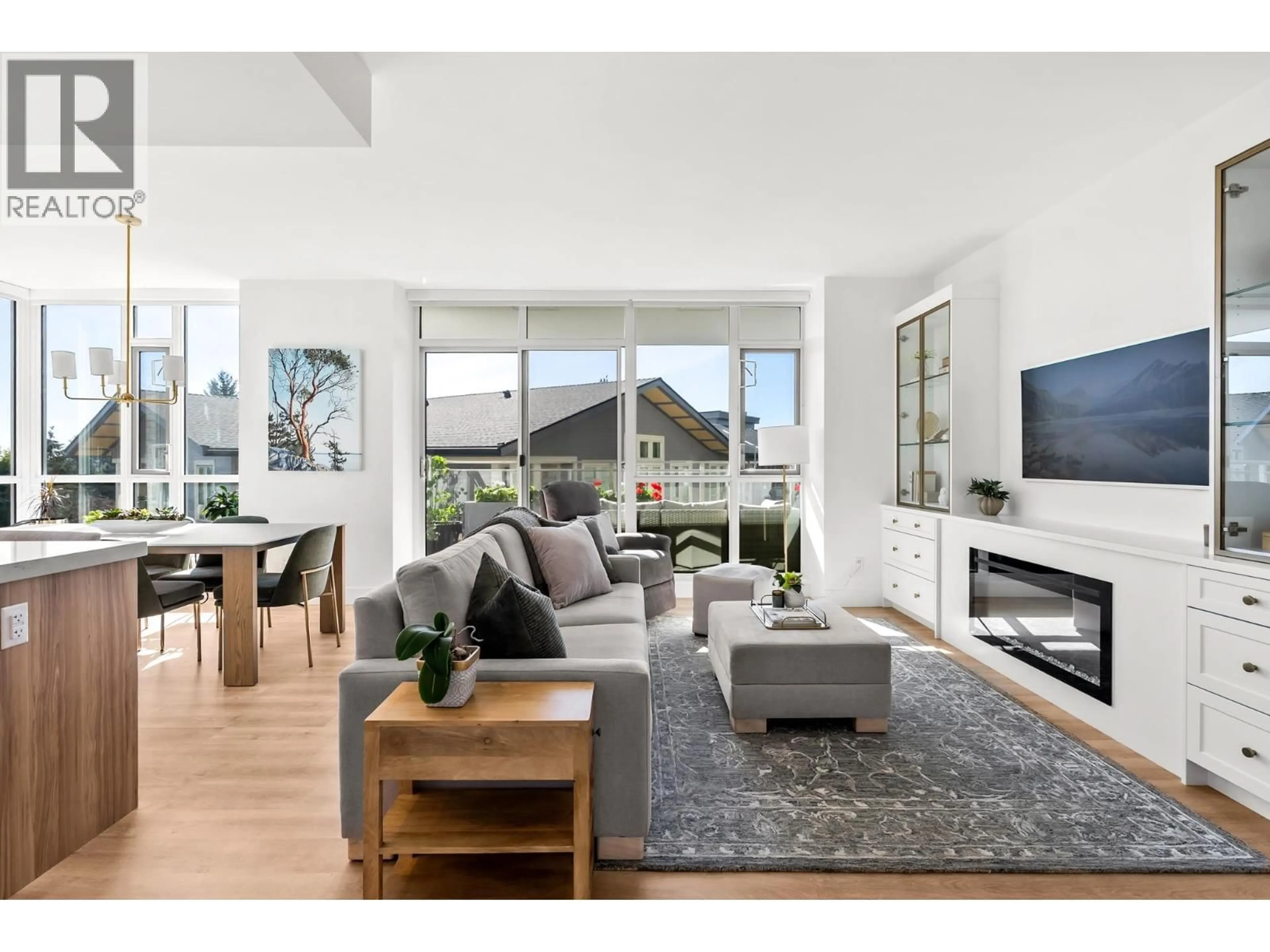 Living room with furniture, wood/laminate floor for 605 - 2325 EMERY COURT, North Vancouver British Columbia V7J0E8