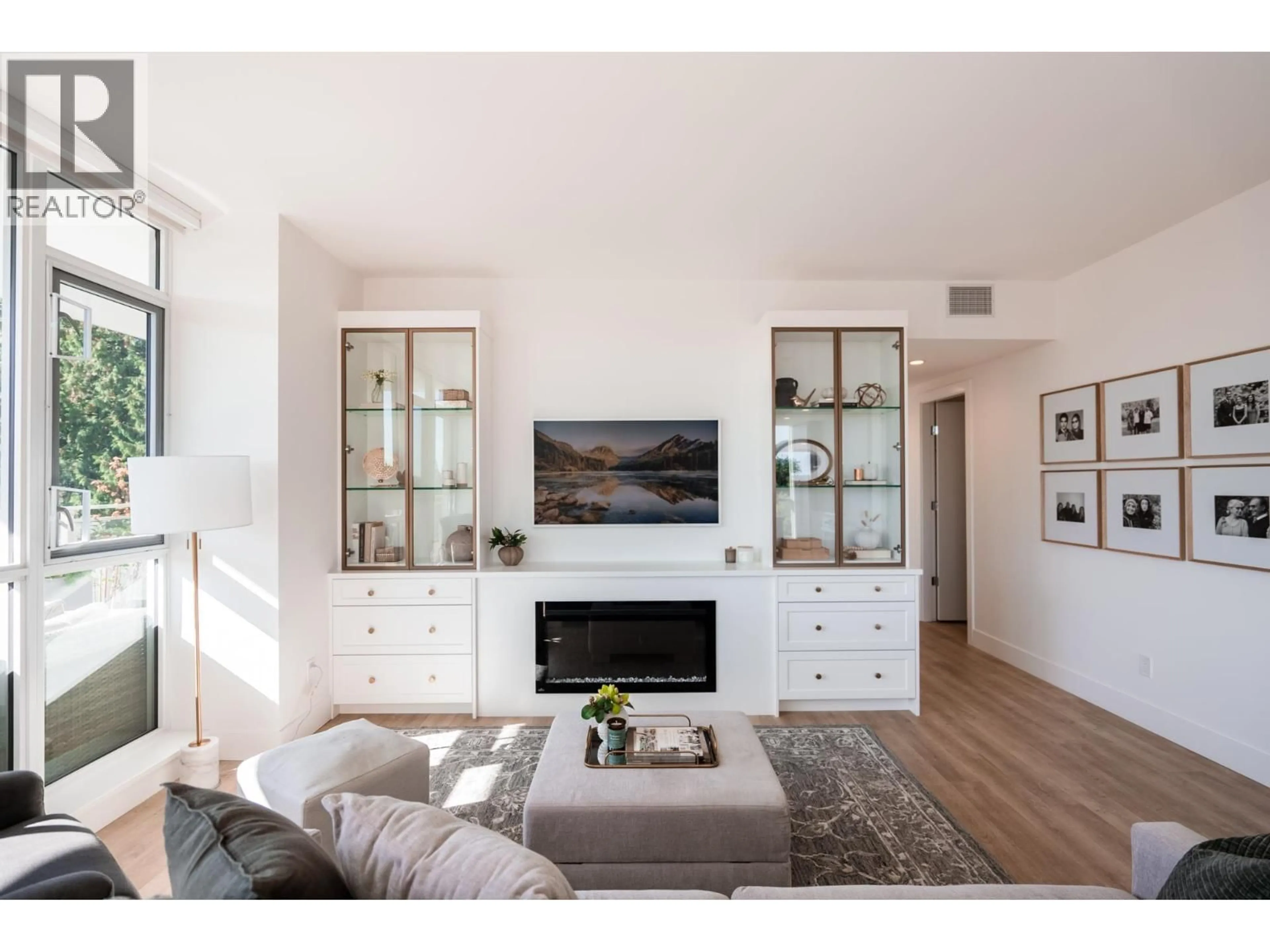 Living room with furniture, wood/laminate floor for 605 - 2325 EMERY COURT, North Vancouver British Columbia V7J0E8