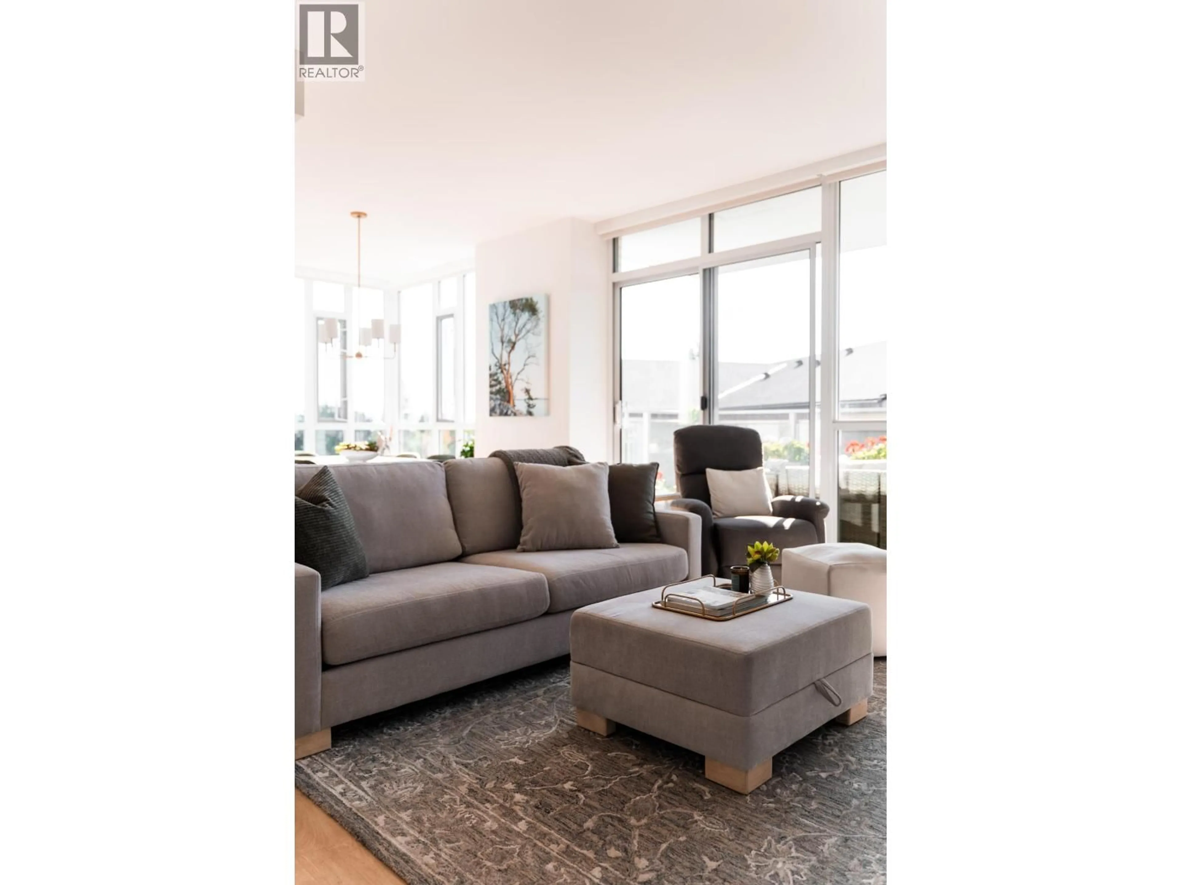 Living room with furniture, wood/laminate floor for 605 - 2325 EMERY COURT, North Vancouver British Columbia V7J0E8