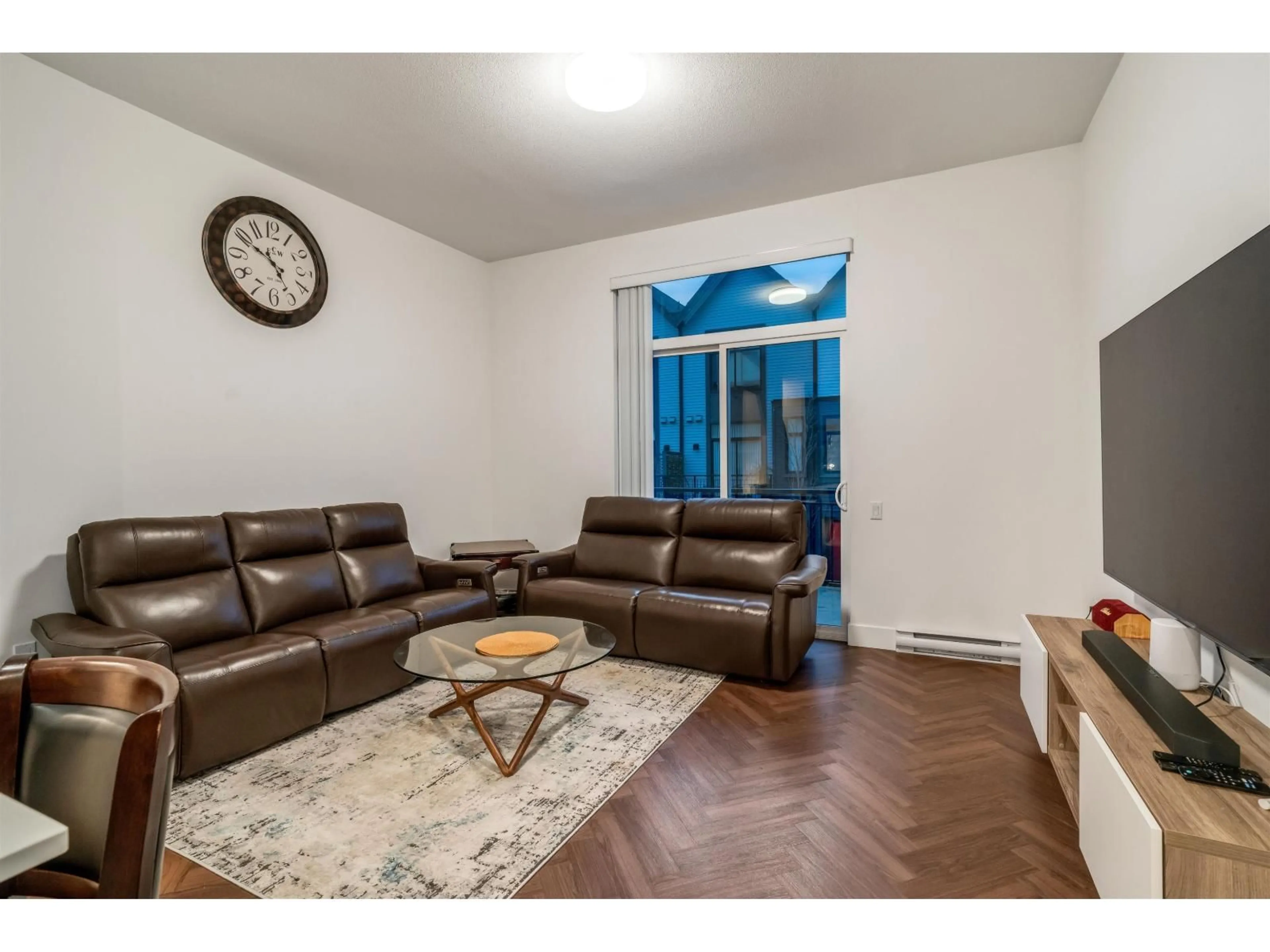 Living room with furniture, wood/laminate floor for 112 - 17578 57A, Surrey British Columbia V3S7V2