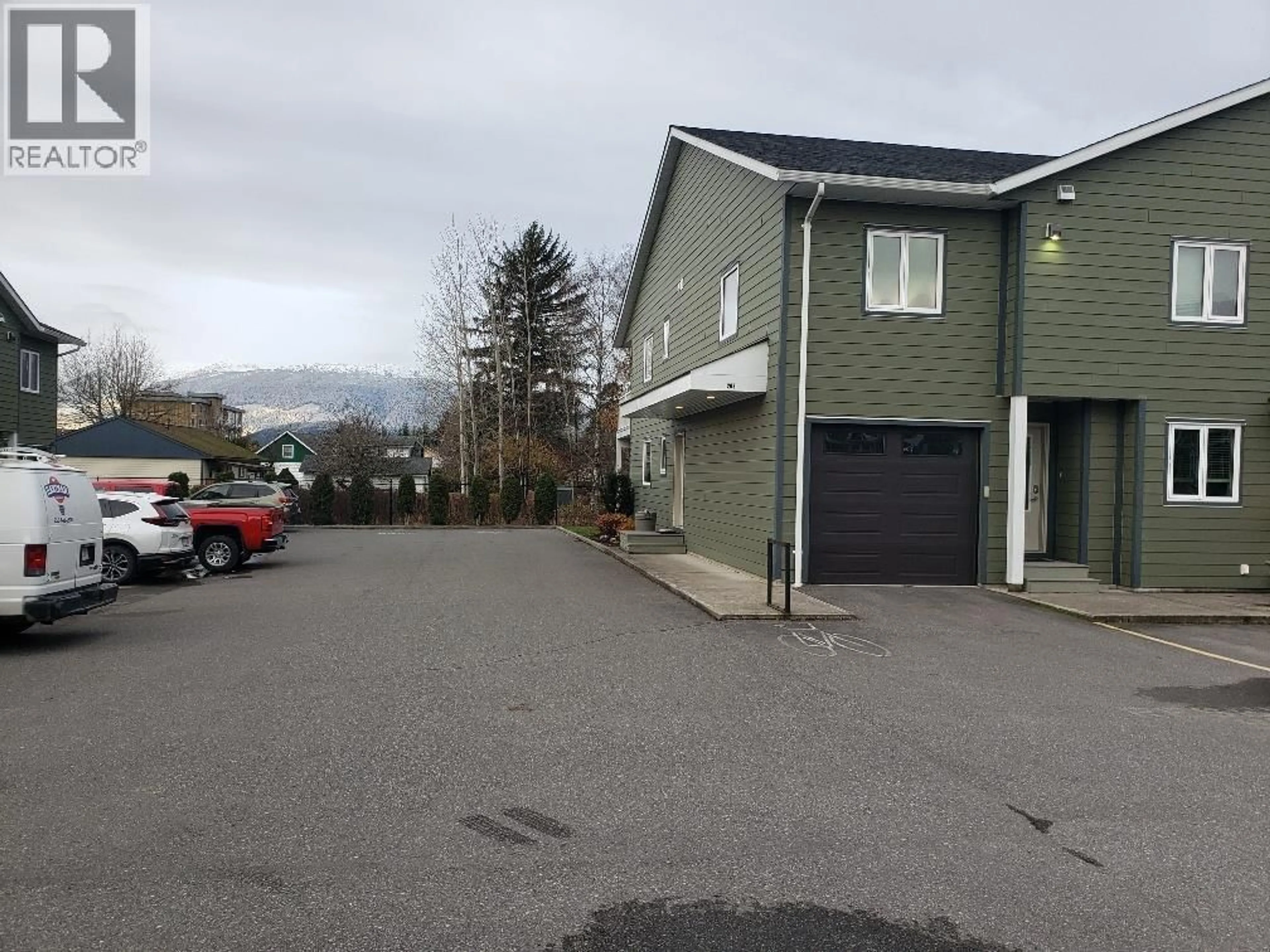 A pic from outside/outdoor area/front of a property/back of a property/a pic from drone, mountain view for 208 - 4719 DAVIS AVENUE, Terrace British Columbia V8G1Y1