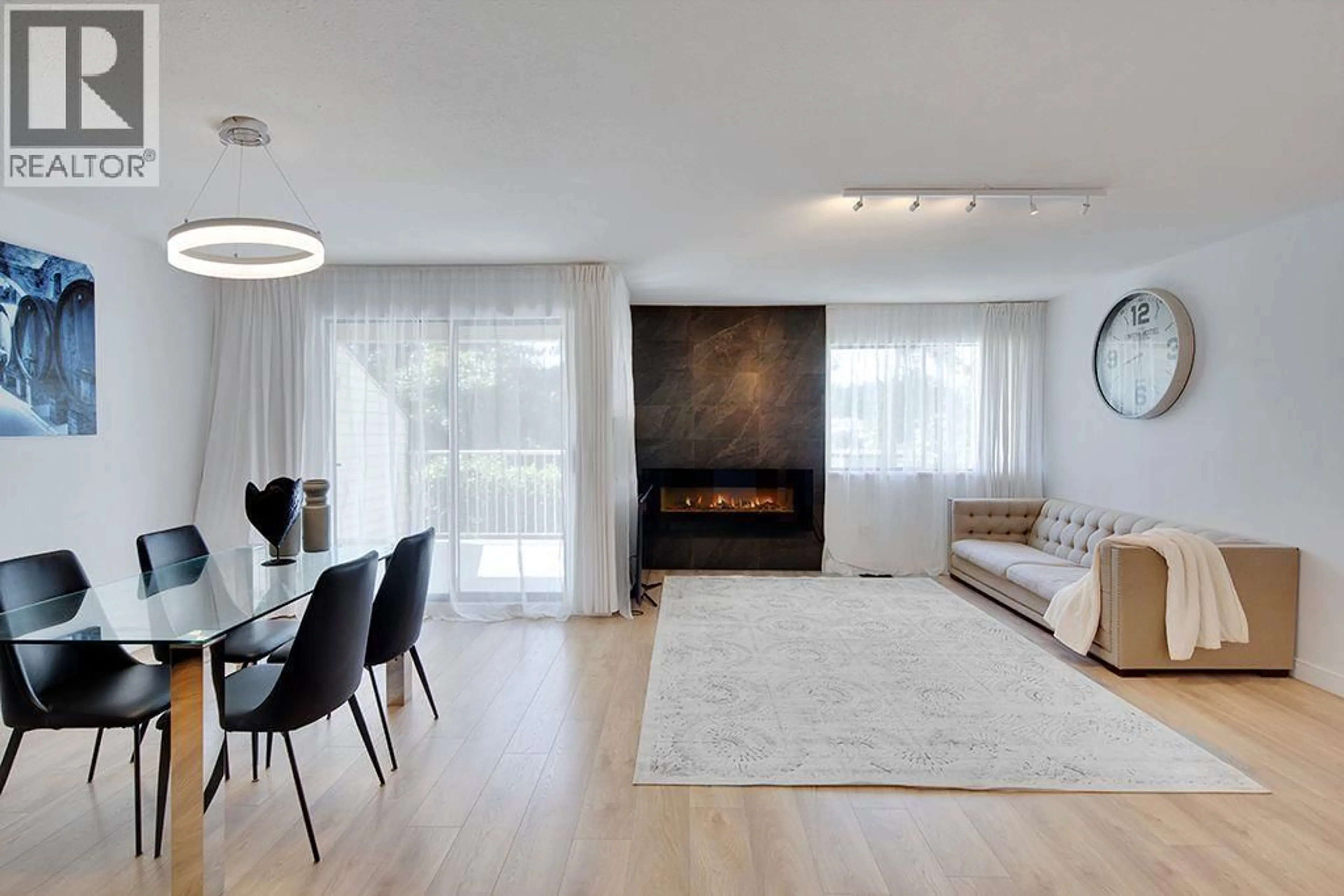 Living room with furniture, wood/laminate floor for 208 - 1220 FALCON DRIVE, Coquitlam British Columbia V3E2E5