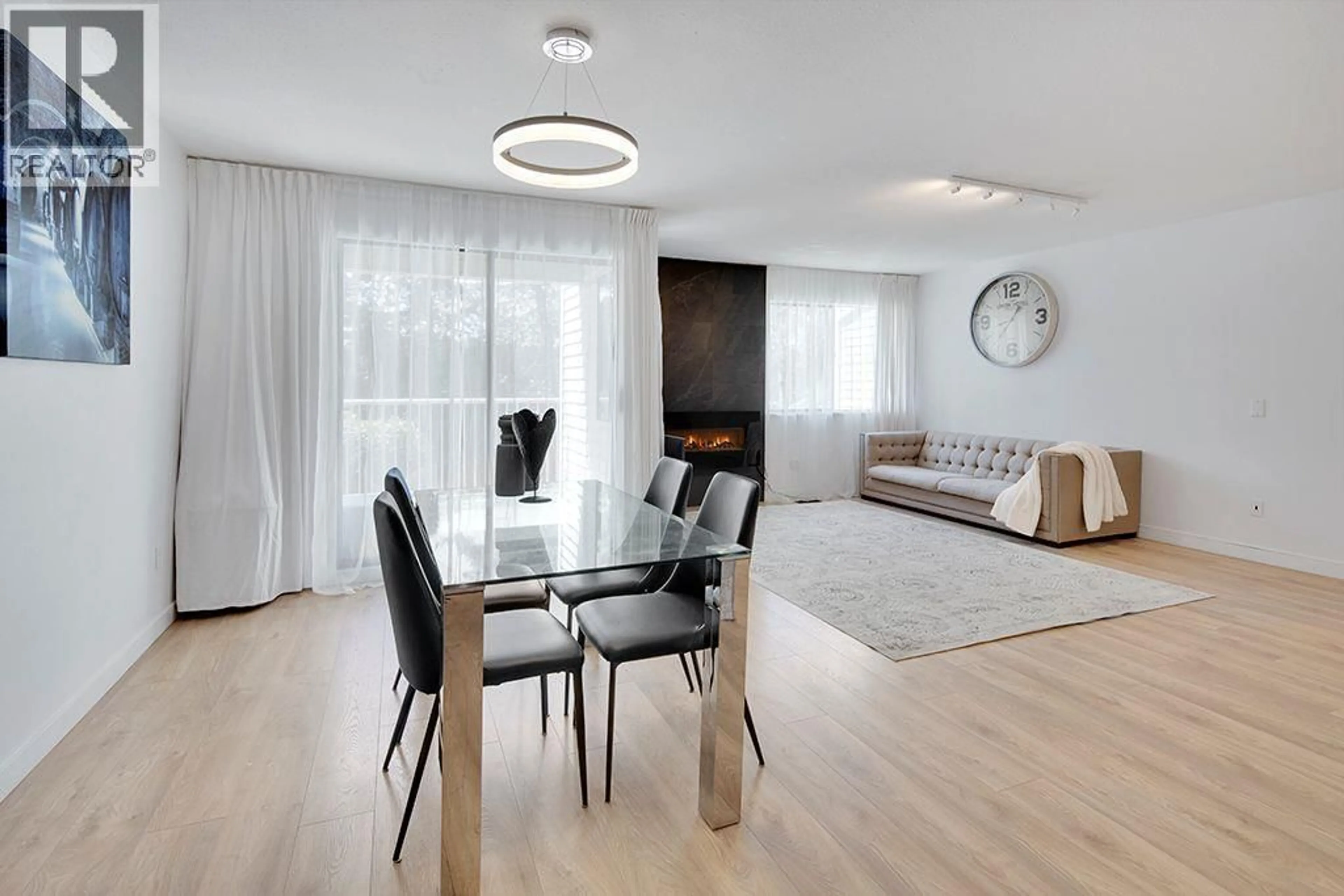 Living room with furniture, wood/laminate floor for 208 - 1220 FALCON DRIVE, Coquitlam British Columbia V3E2E5