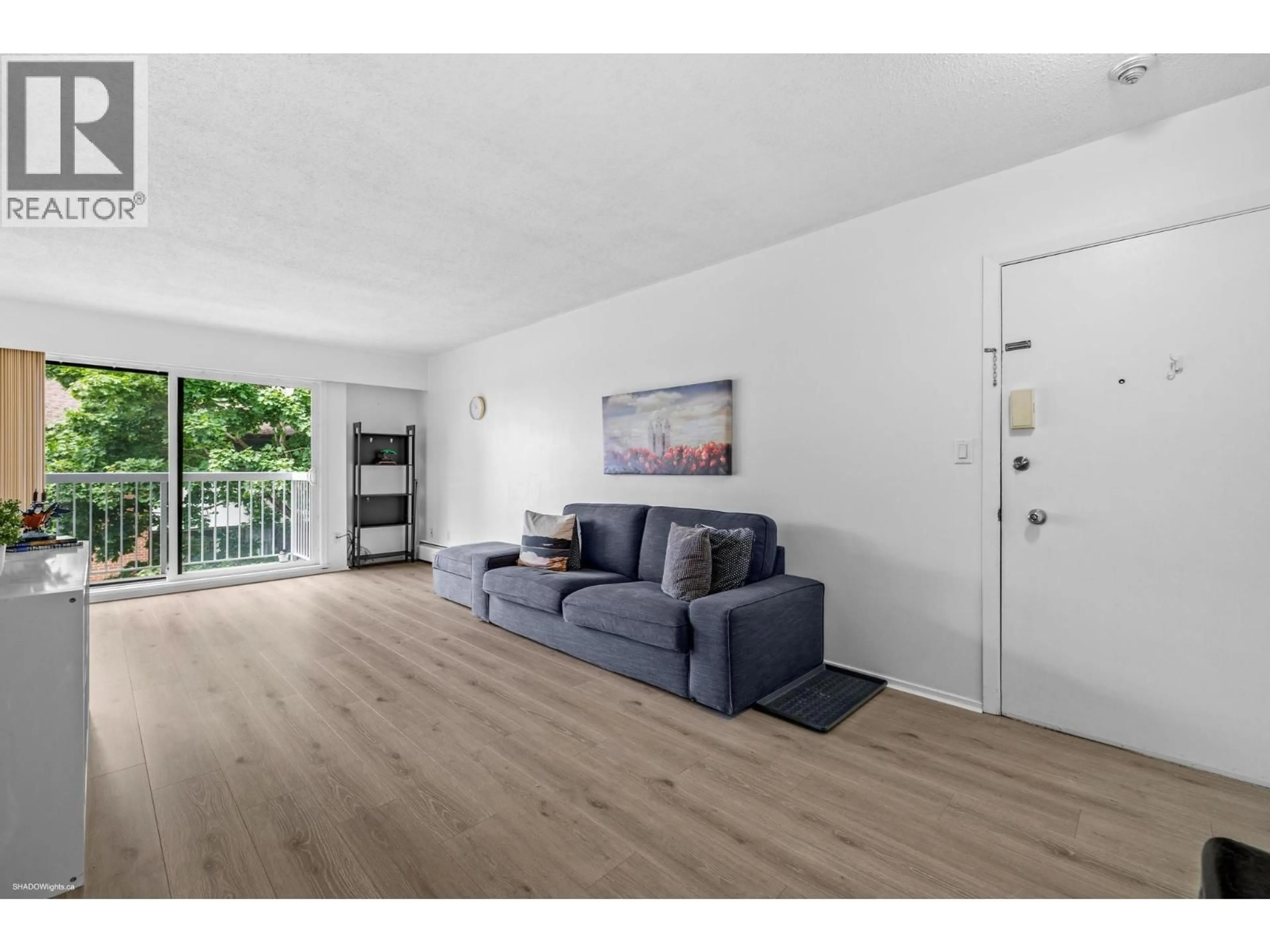 Living room with furniture, wood/laminate floor for 308 - 8040 RYAN ROAD, Richmond British Columbia V7A2E5