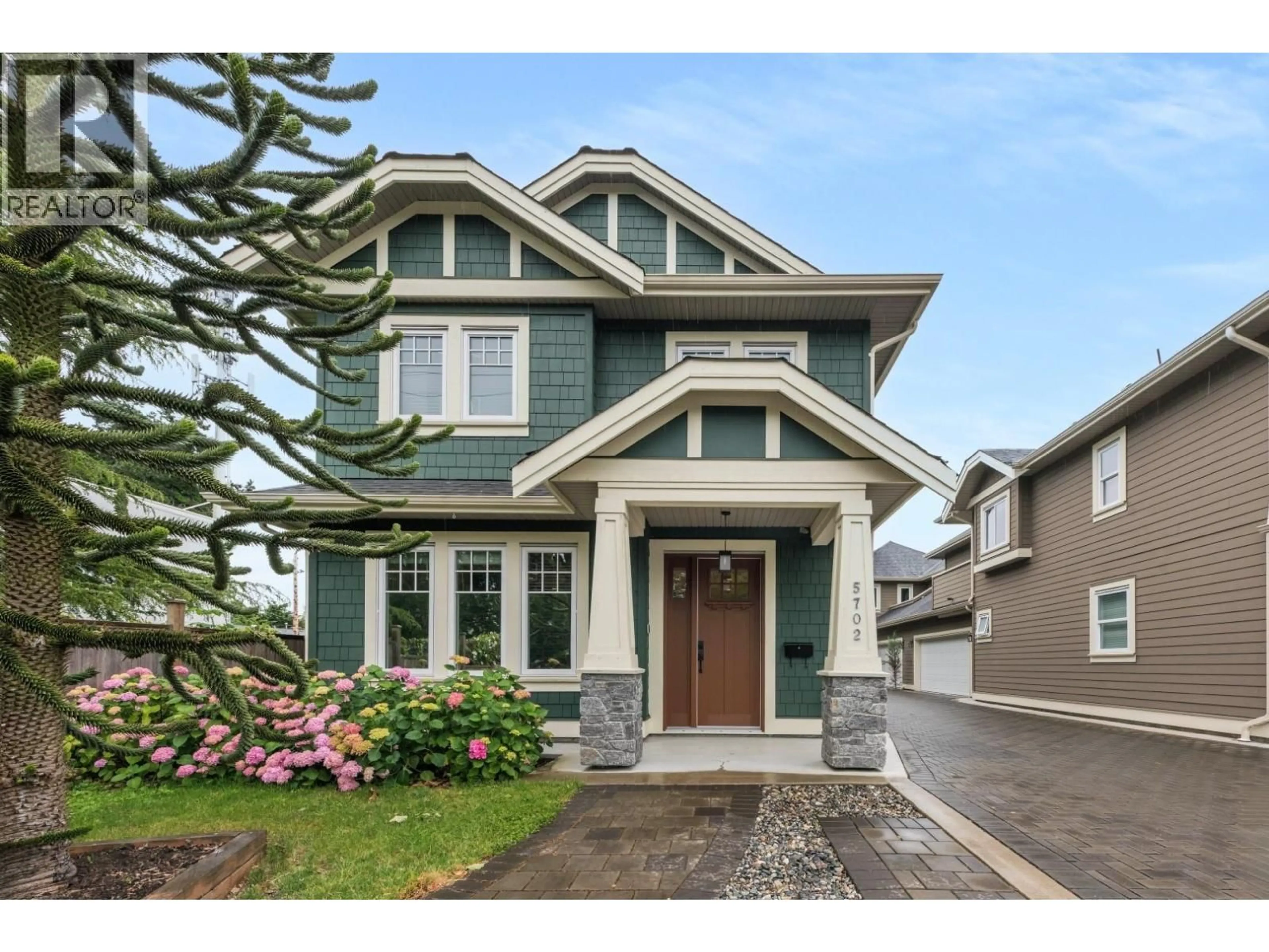 Home with vinyl exterior material, street for 5702 WILLIAMS ROAD, Richmond British Columbia V7E1K3