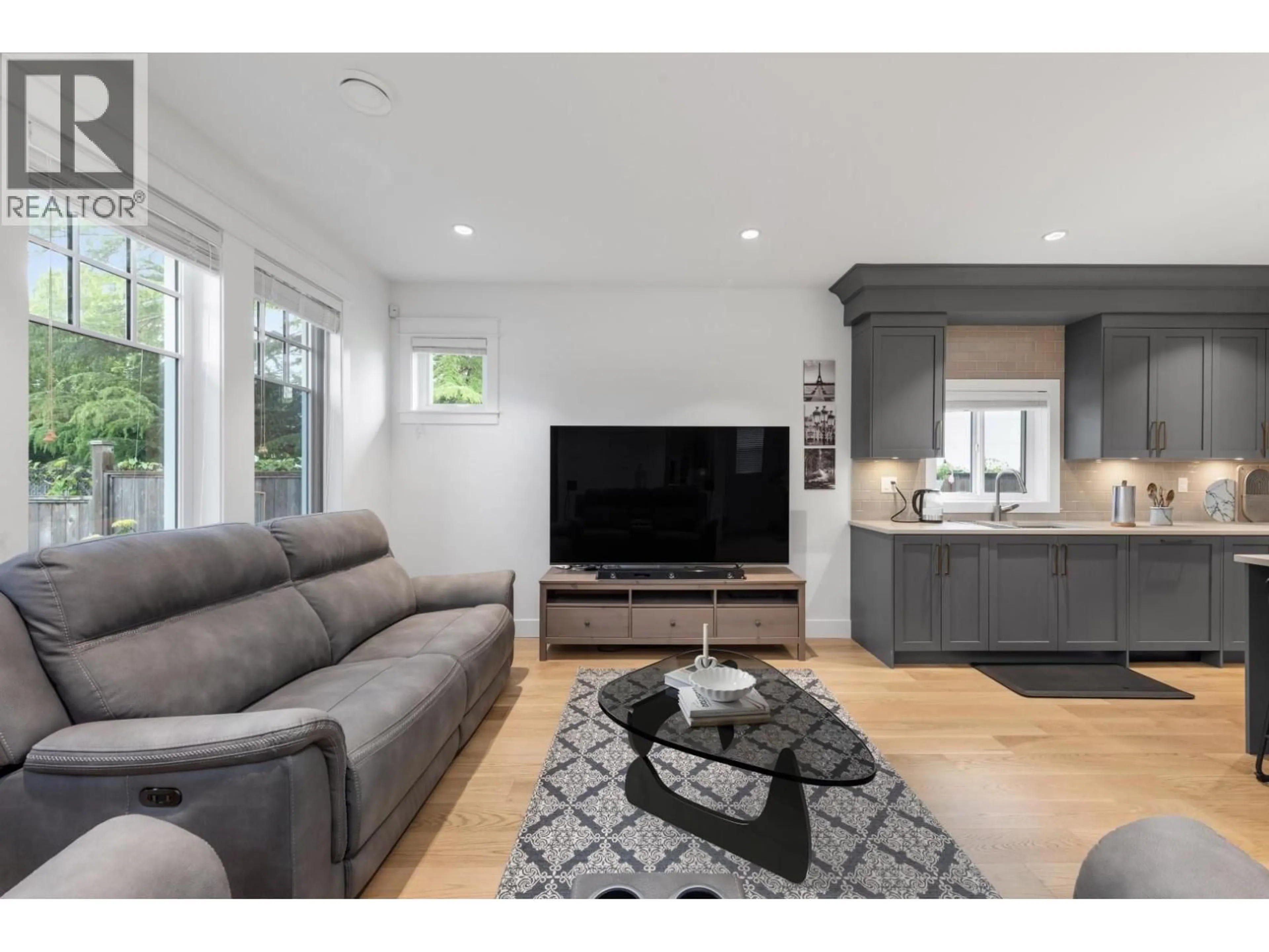 Living room with furniture, wood/laminate floor for 5702 WILLIAMS ROAD, Richmond British Columbia V7E1K3