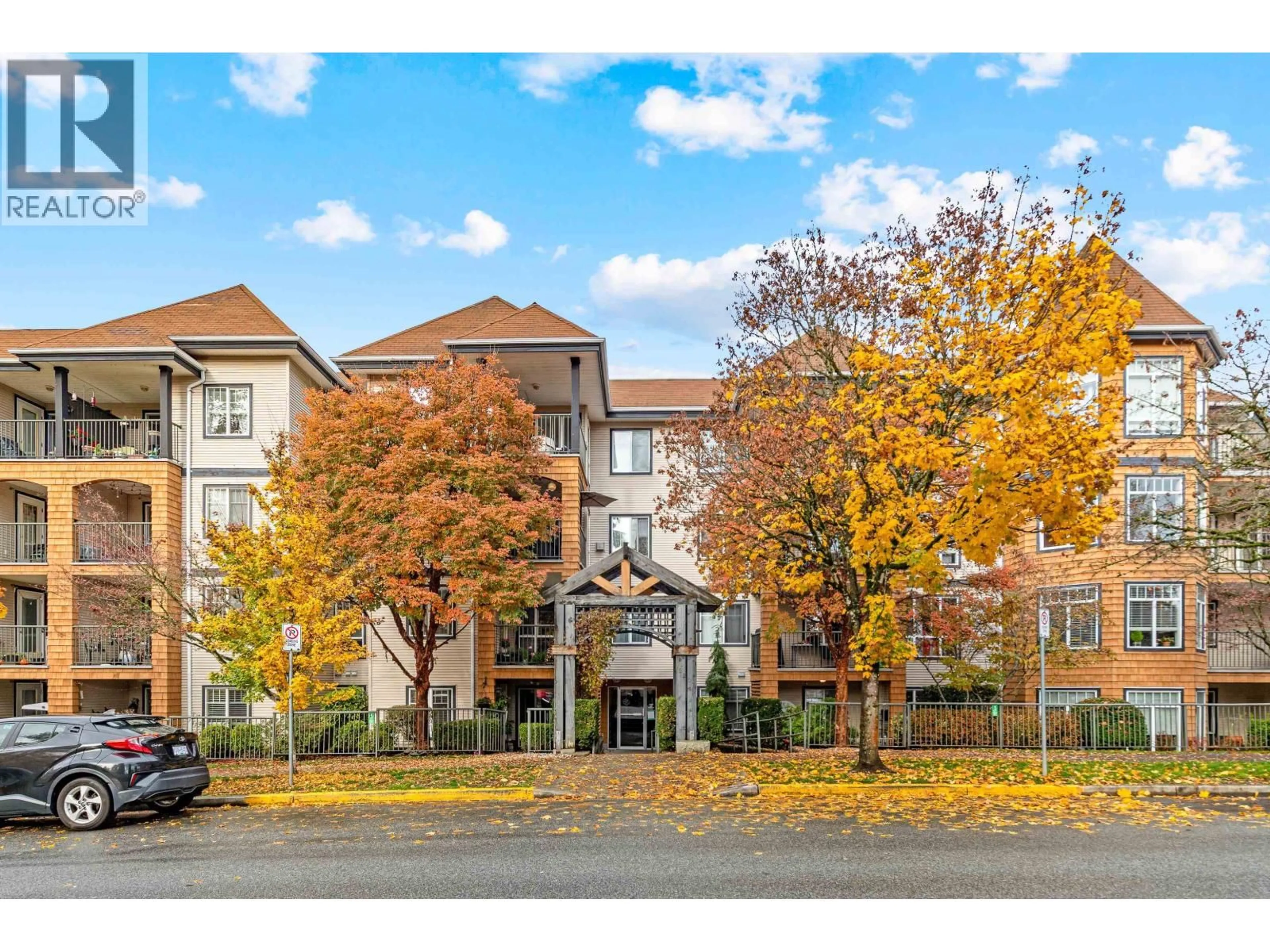 A pic from outside/outdoor area/front of a property/back of a property/a pic from drone, street for 409 - 12207 224 STREET, Maple Ridge British Columbia V2X6B9