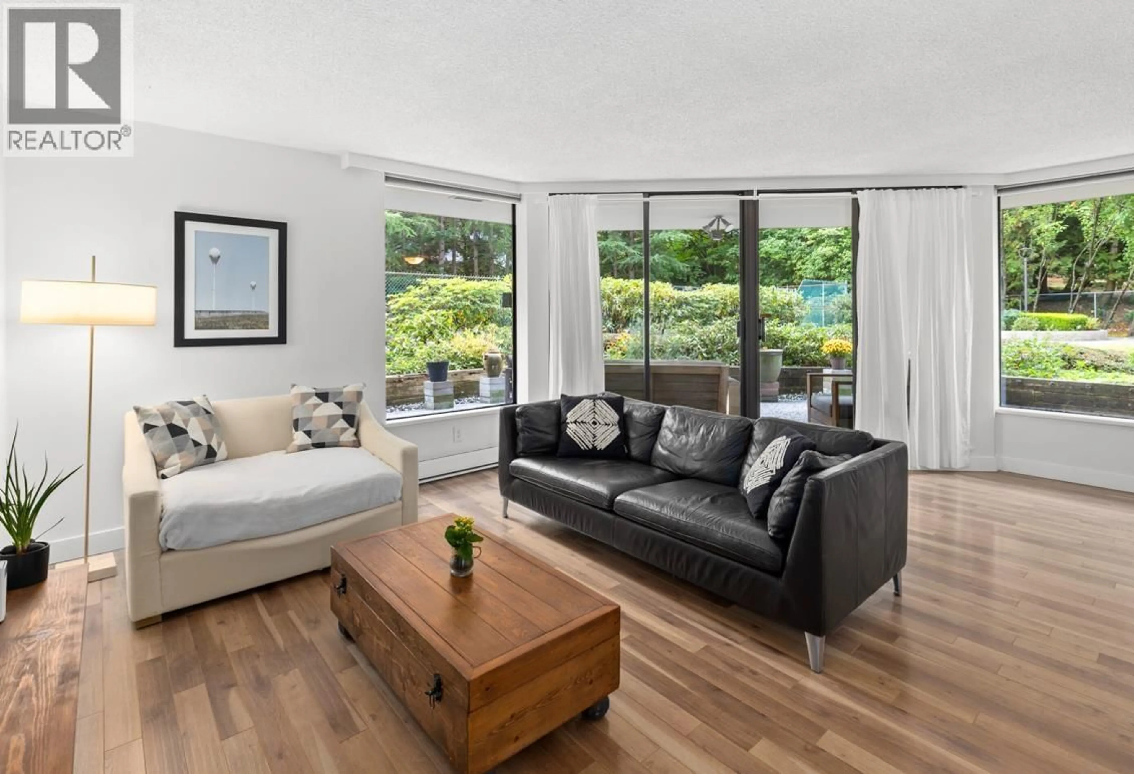 Living room with furniture, wood/laminate floor for 202 - 2041 BELLWOOD AVENUE, Burnaby British Columbia V5B4V5