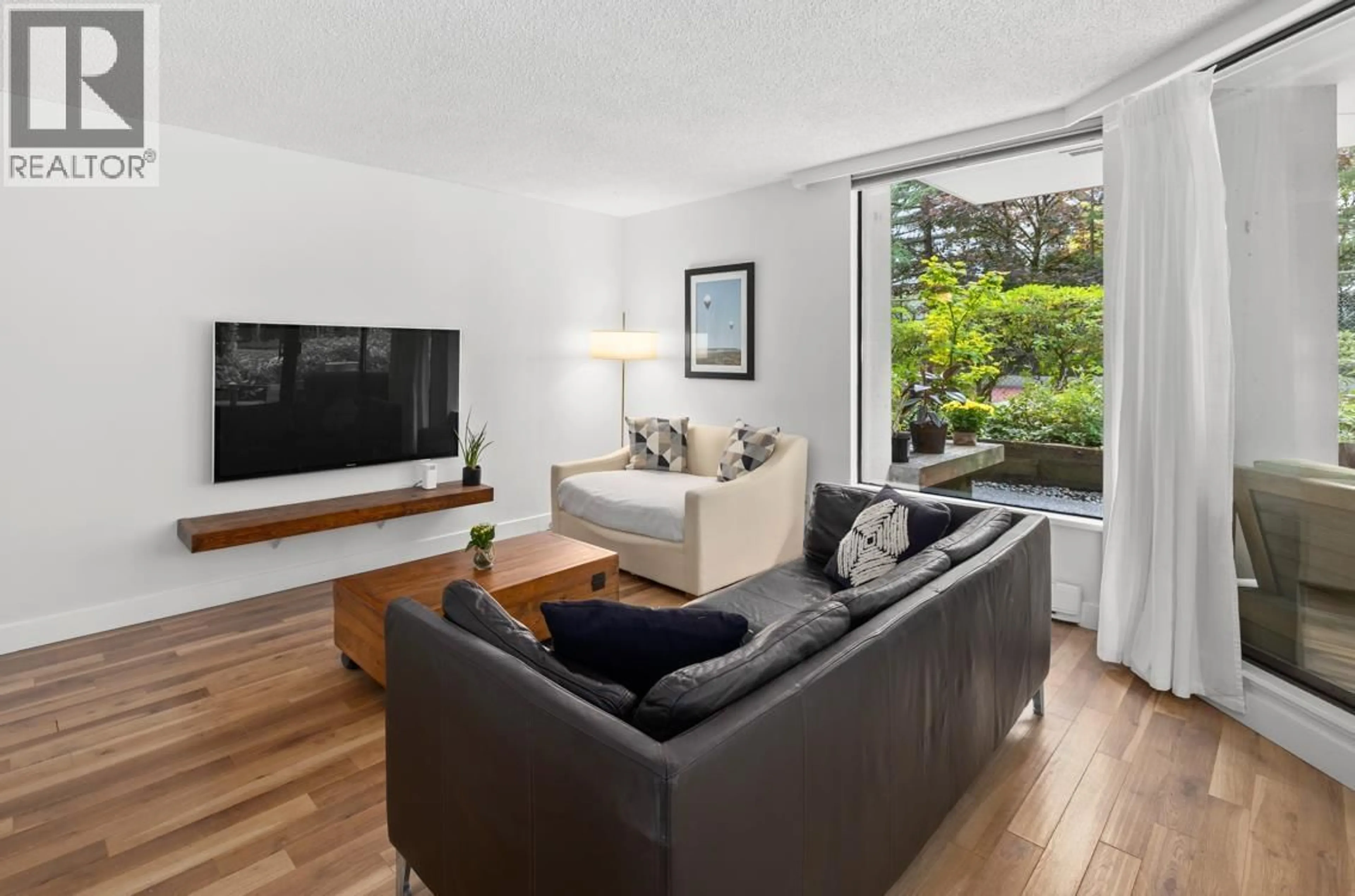 Living room with furniture, wood/laminate floor for 202 - 2041 BELLWOOD AVENUE, Burnaby British Columbia V5B4V5