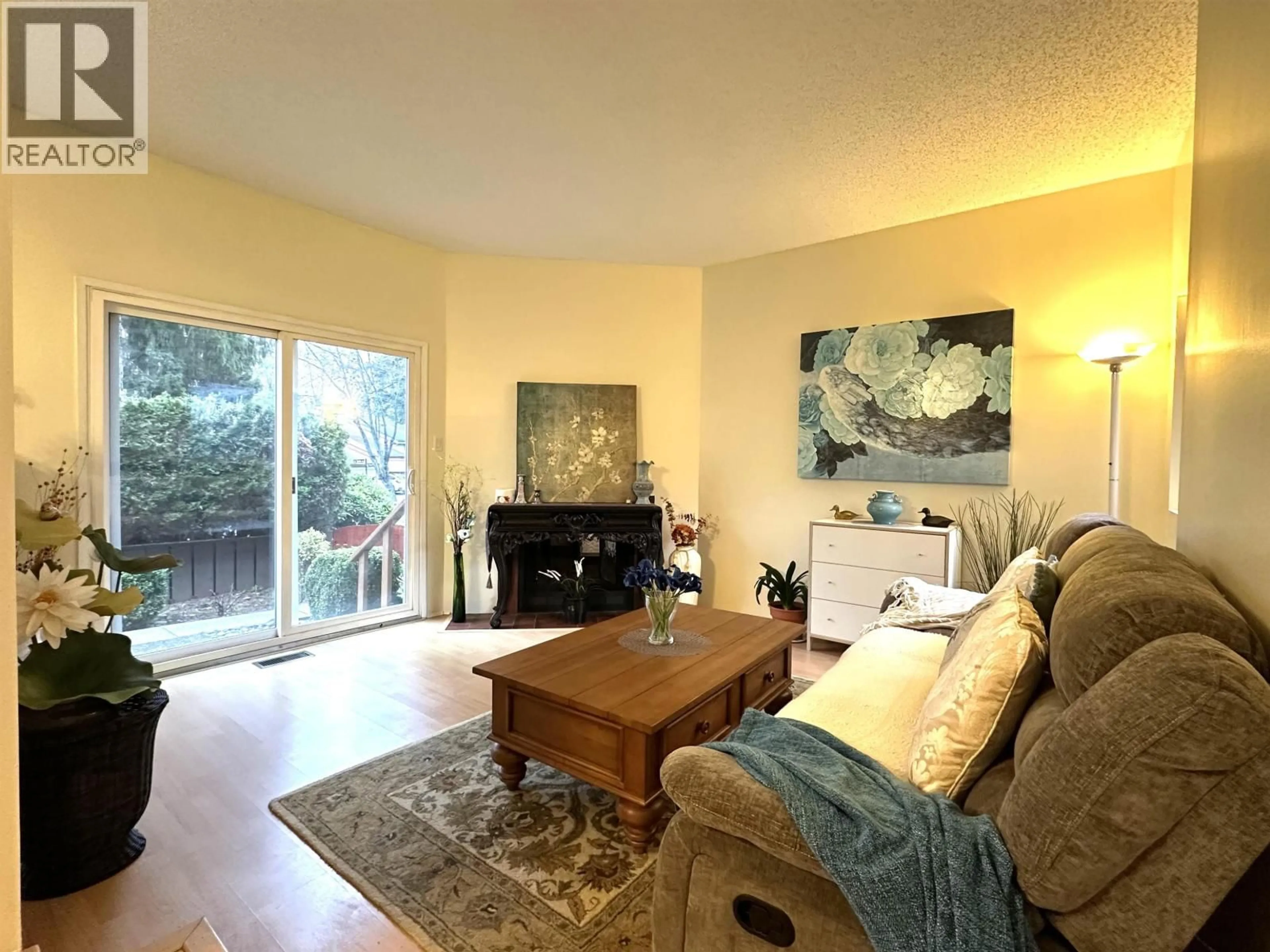 Living room with furniture, wood/laminate floor for 3638 HENNEPIN AVENUE, Vancouver British Columbia V5S4C5