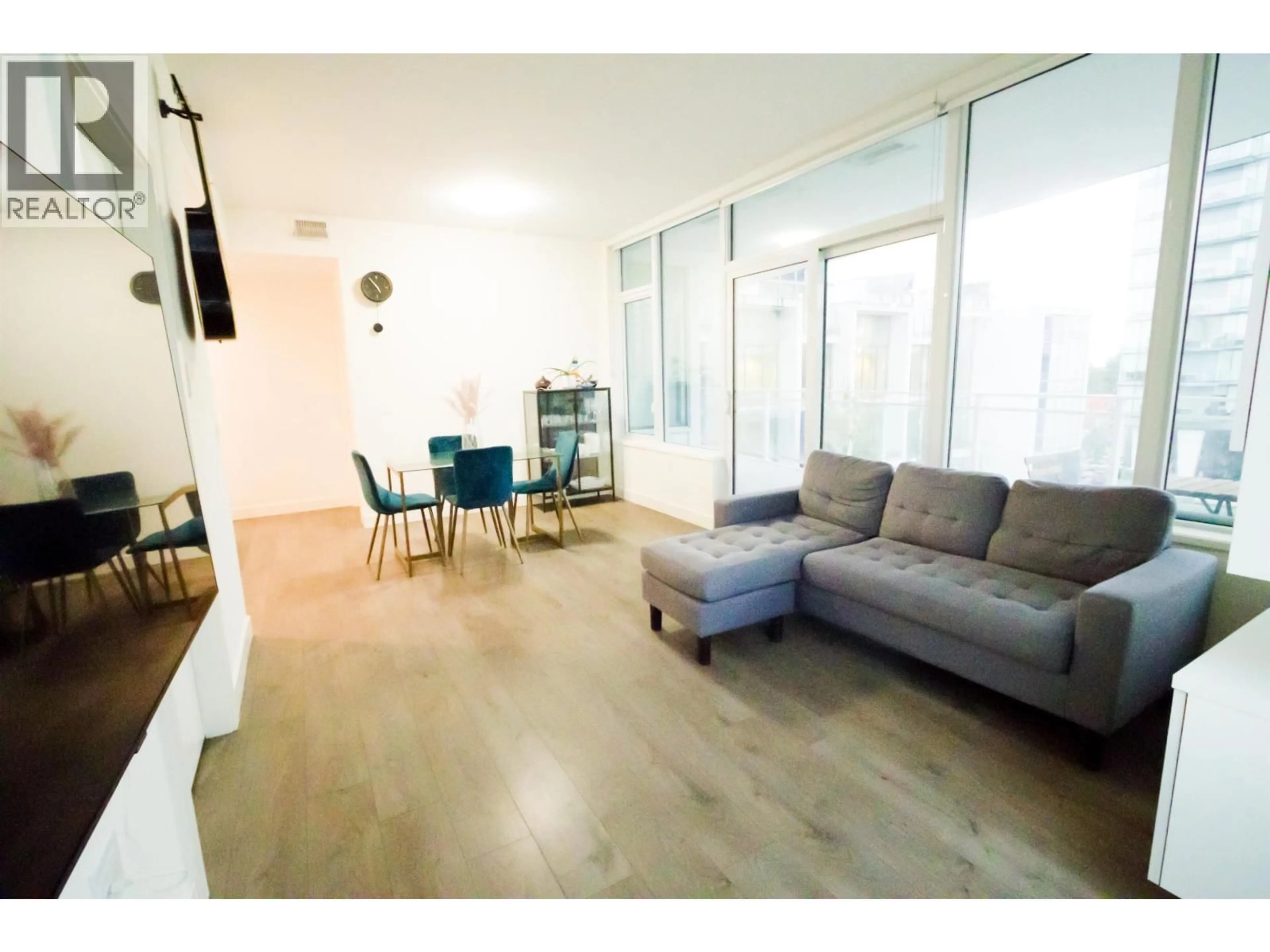 Living room with furniture, wood/laminate floor for 407 - 5051 IMPERIAL STREET, Burnaby British Columbia V5J0J3