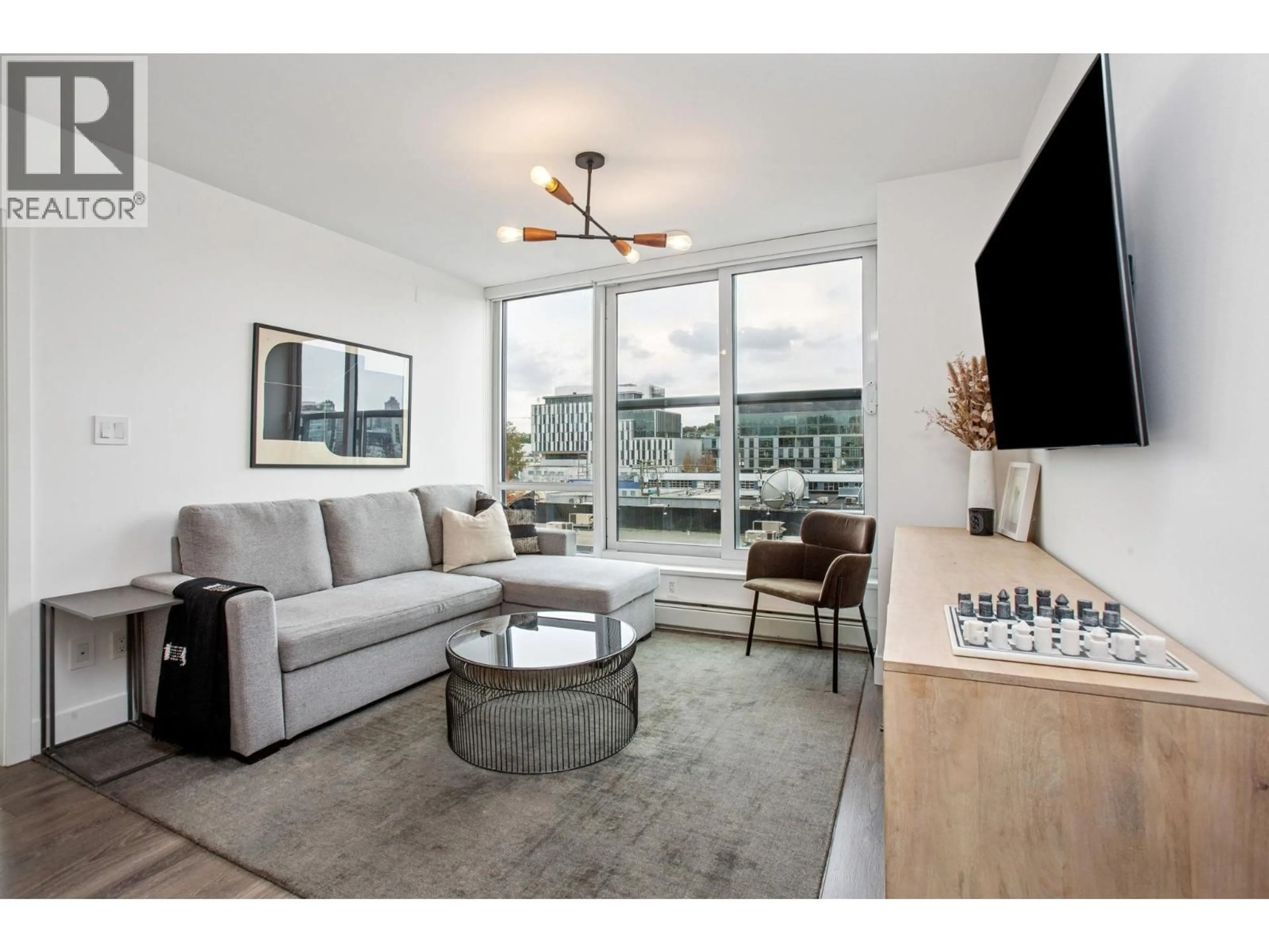 Living room with furniture, unknown for 607 - 1788 COLUMBIA STREET, Vancouver British Columbia V5Y0L7