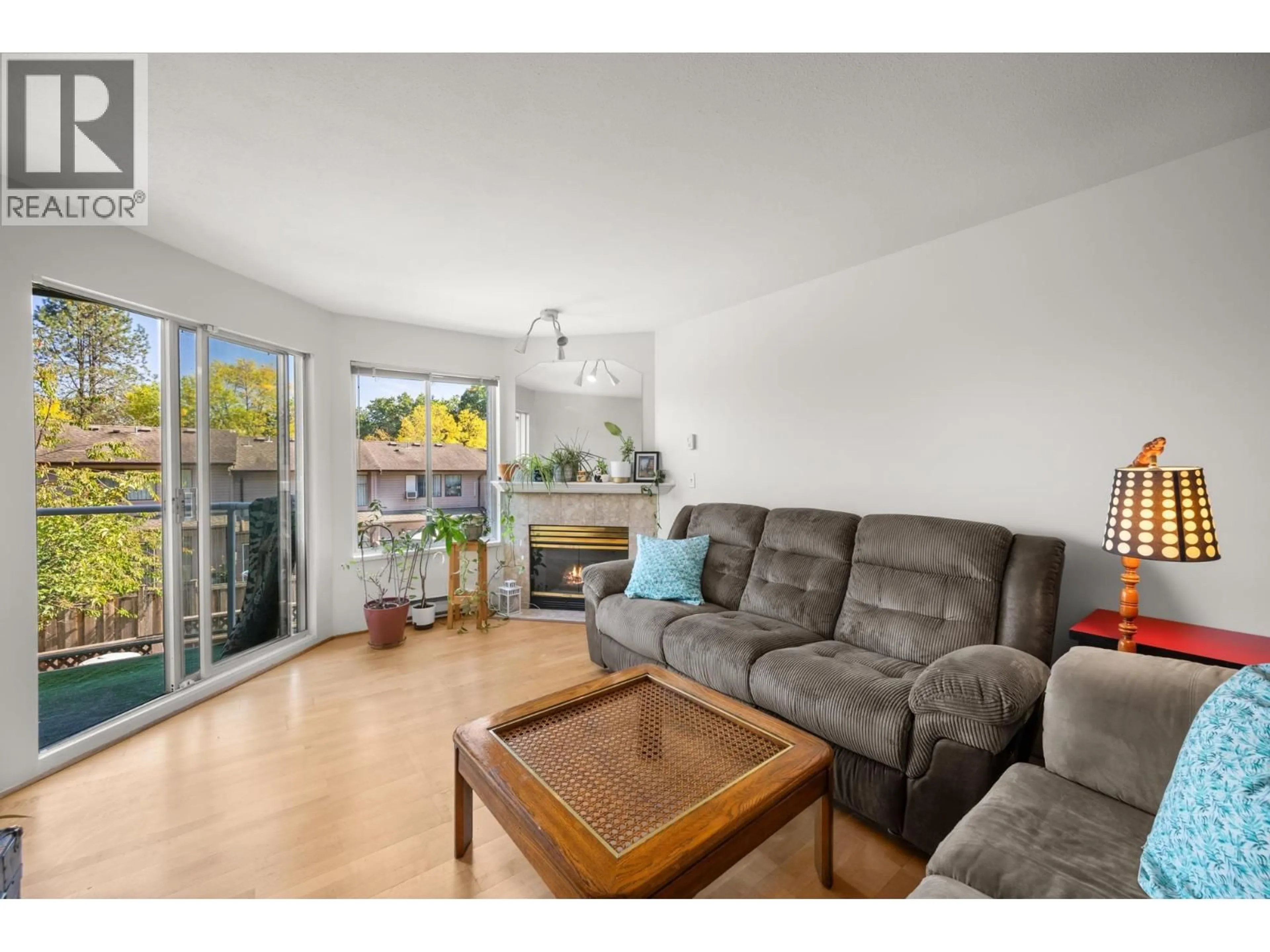 Living room with furniture, wood/laminate floor for 207 - 1171 PIPELINE ROAD, Coquitlam British Columbia V3B4R9