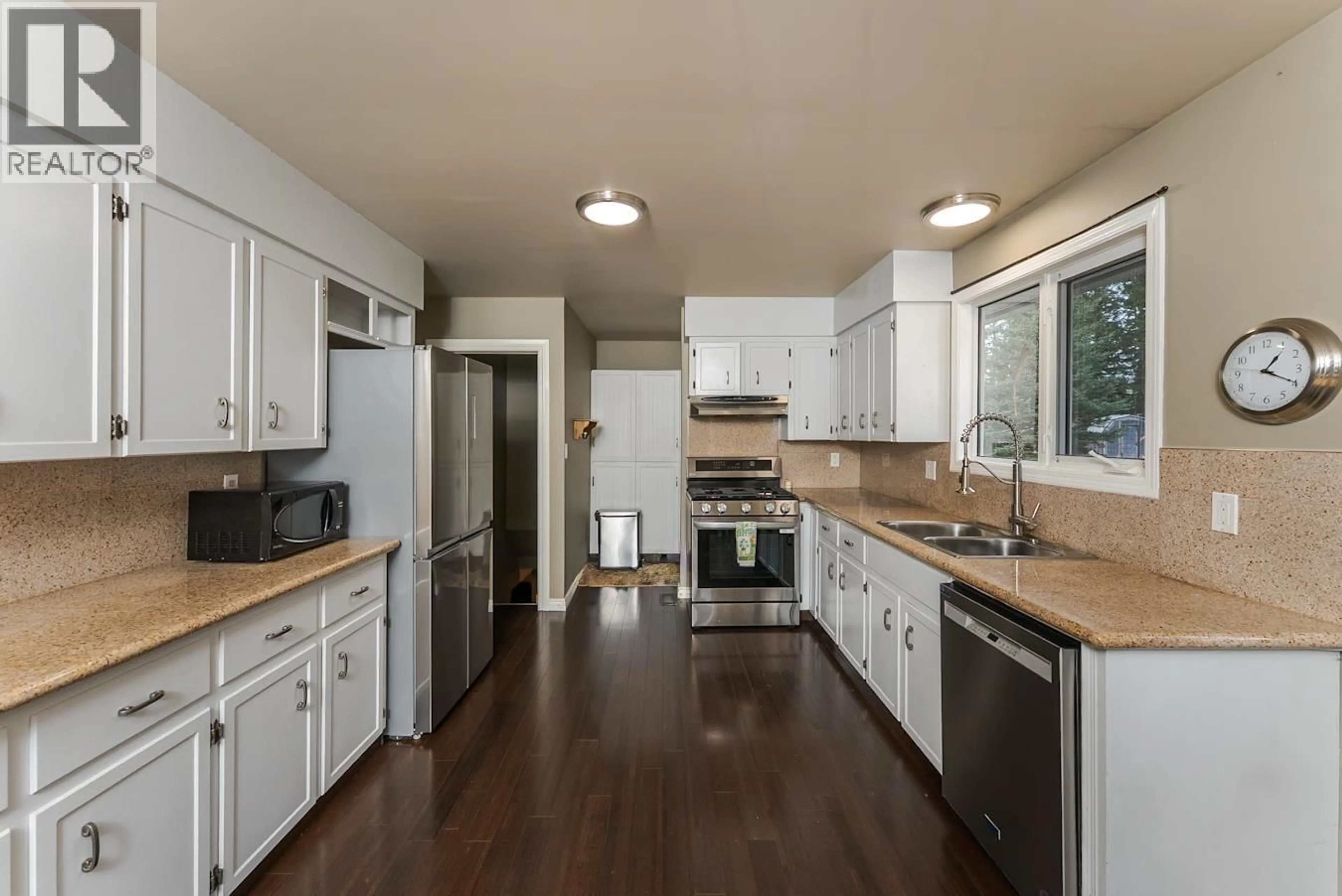 Open concept kitchen, wood/laminate floor for 13950 ATHABASCA DRIVE, Prince George British Columbia V2N5X9