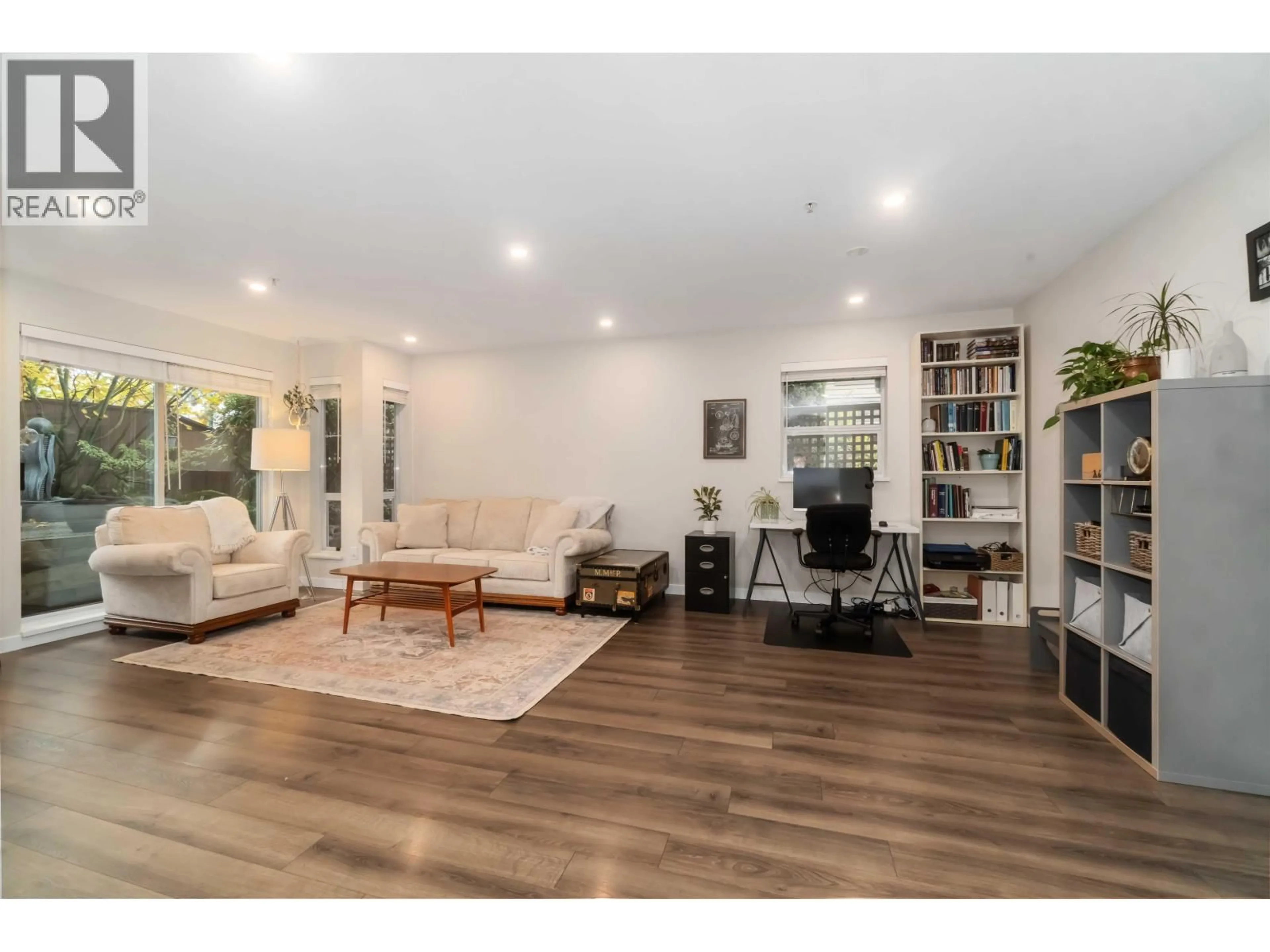 Living room with furniture, wood/laminate floor for 310 - 1000 BOWRON COURT, North Vancouver British Columbia V7H2V8