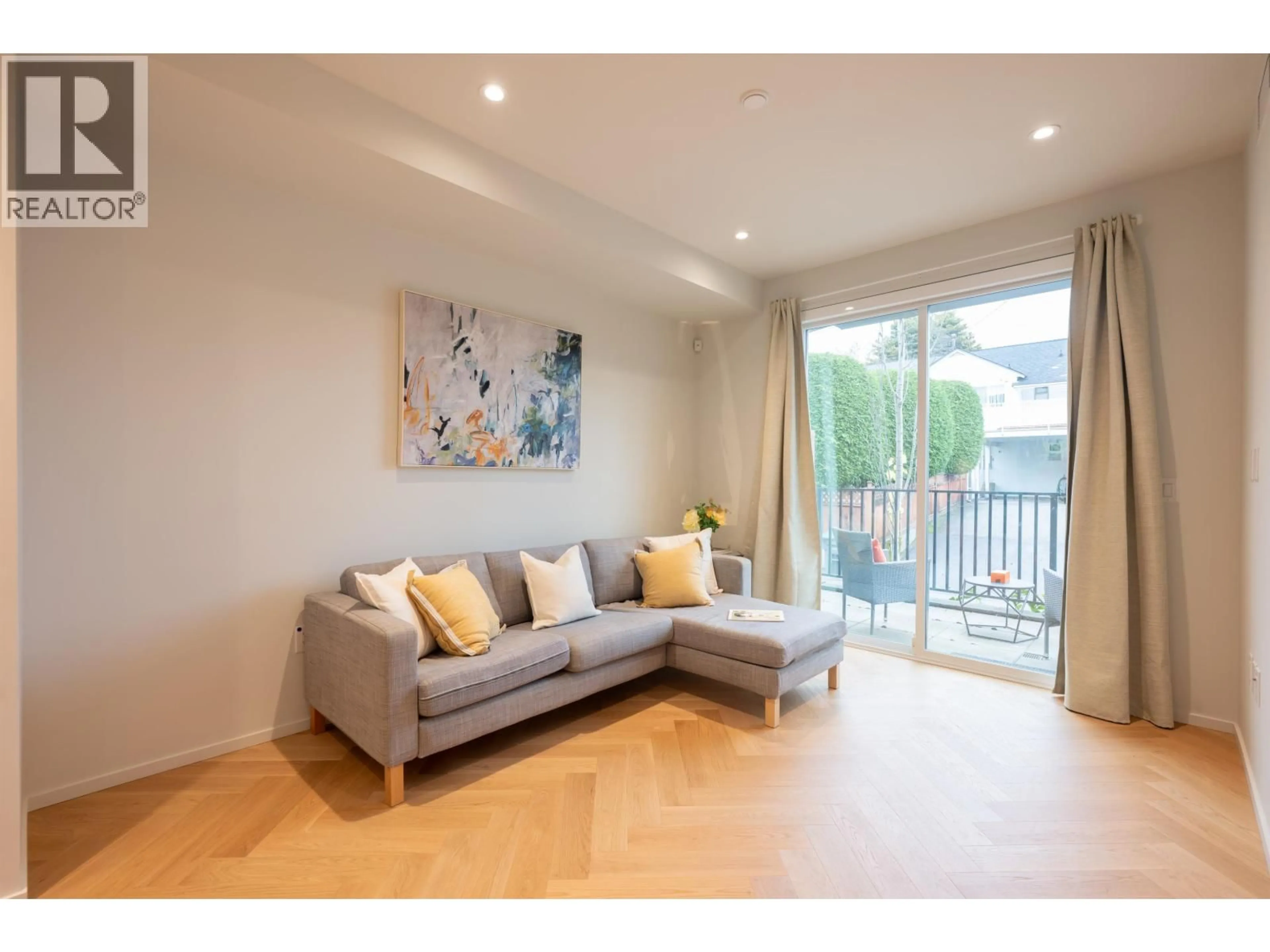 Living room with furniture, wood/laminate floor for 173 - 805 49TH AVENUE, Vancouver British Columbia V5Z0A1