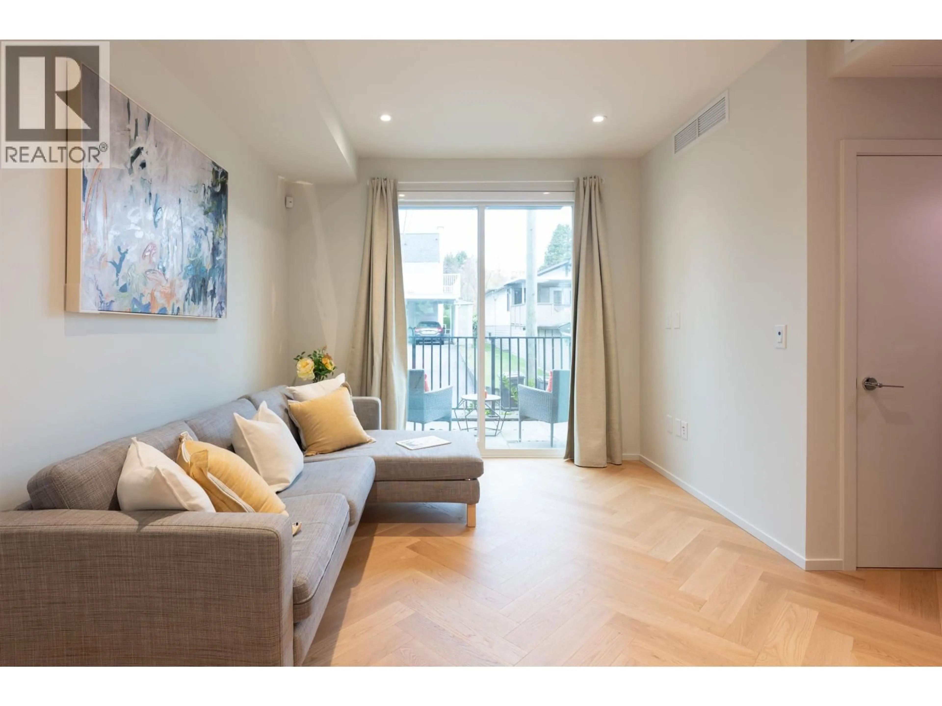 Living room with furniture, wood/laminate floor for 173 - 805 49TH AVENUE, Vancouver British Columbia V5Z0A1