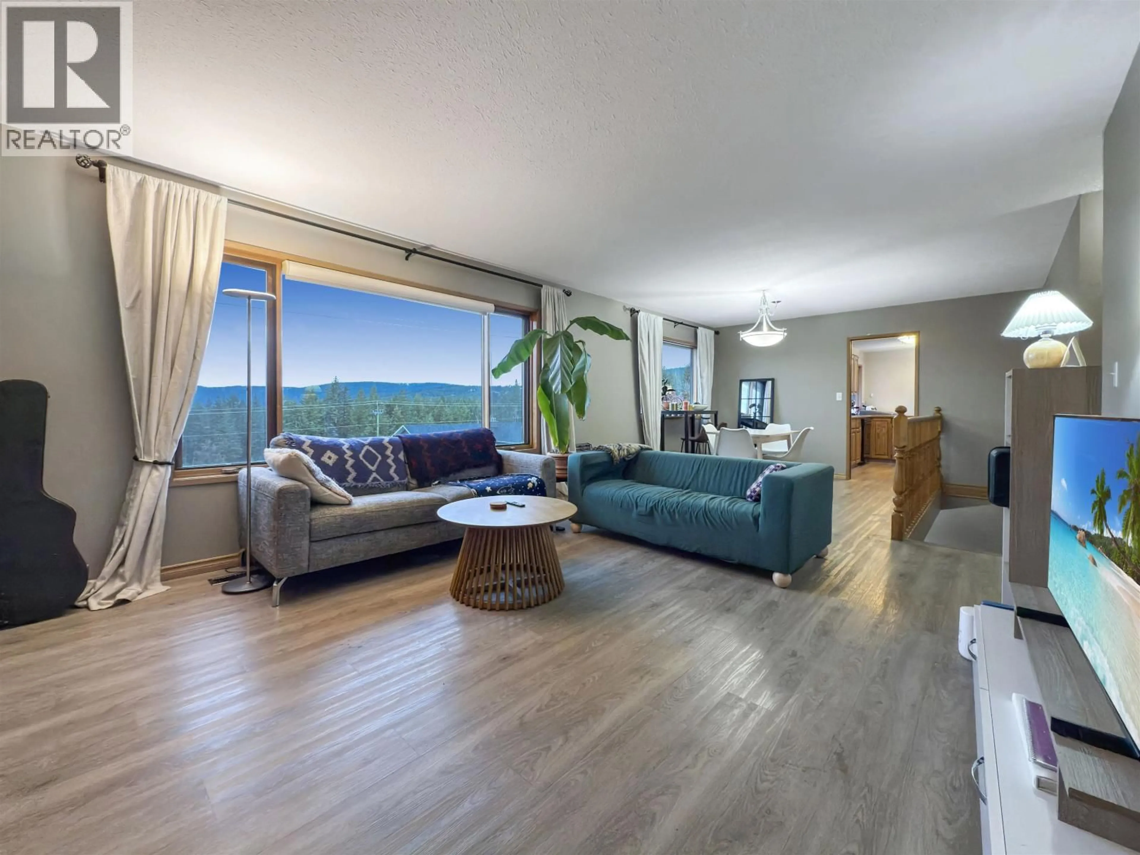 Living room with furniture, wood/laminate floor for 93 WESTRIDGE DRIVE, Williams Lake British Columbia V2G5K3